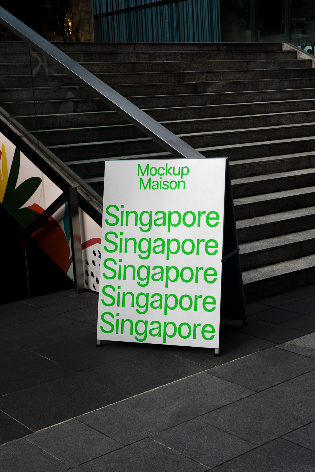 PSD mockup of a signboard on an urban street featuring the word "Singapore" repeatedly in green text with steps and a railing in the background.