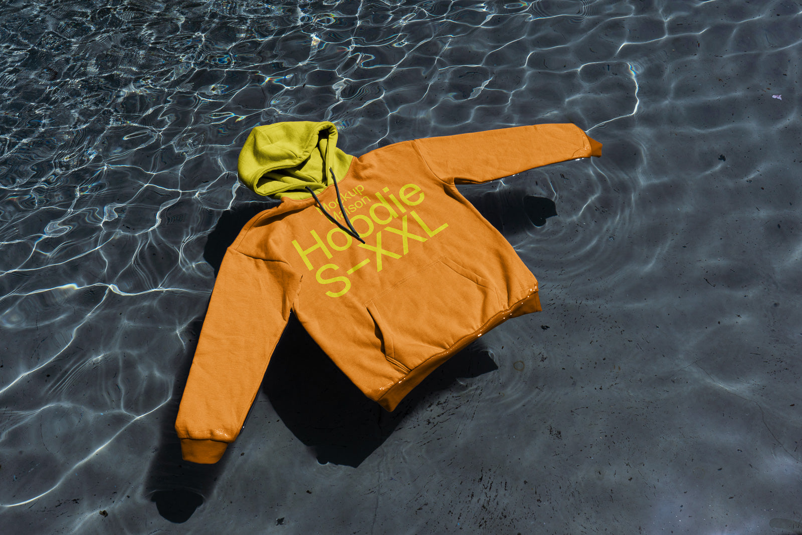 PSD mockup of an orange hoodie with a green hood floating on water, featuring large text indicating sizing from S to XXL on the front.