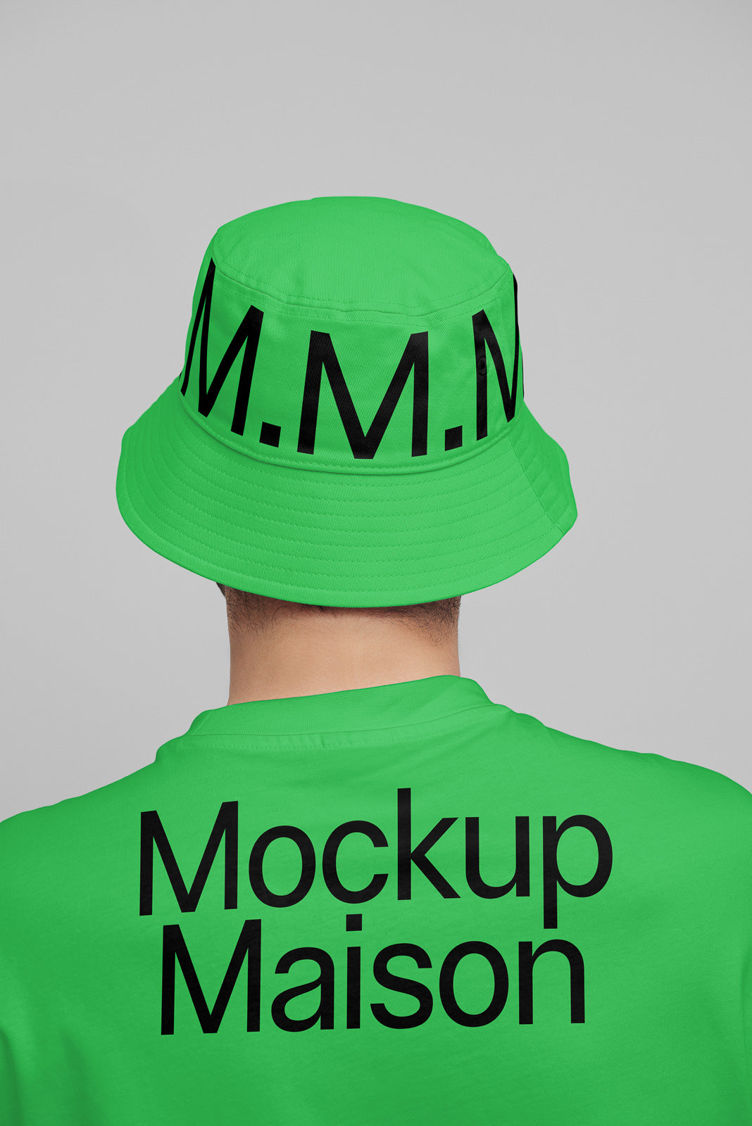 PSD mockup of a person wearing a bright green bucket hat and matching shirt with bold black lettering on the back and hat.
