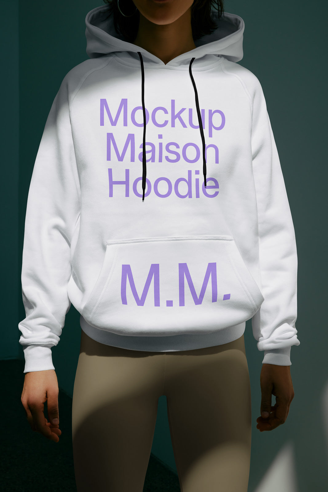PSD mockup of a person wearing a white hoodie with purple text "Mockup Maison Hoodie M.M." against a dark background.