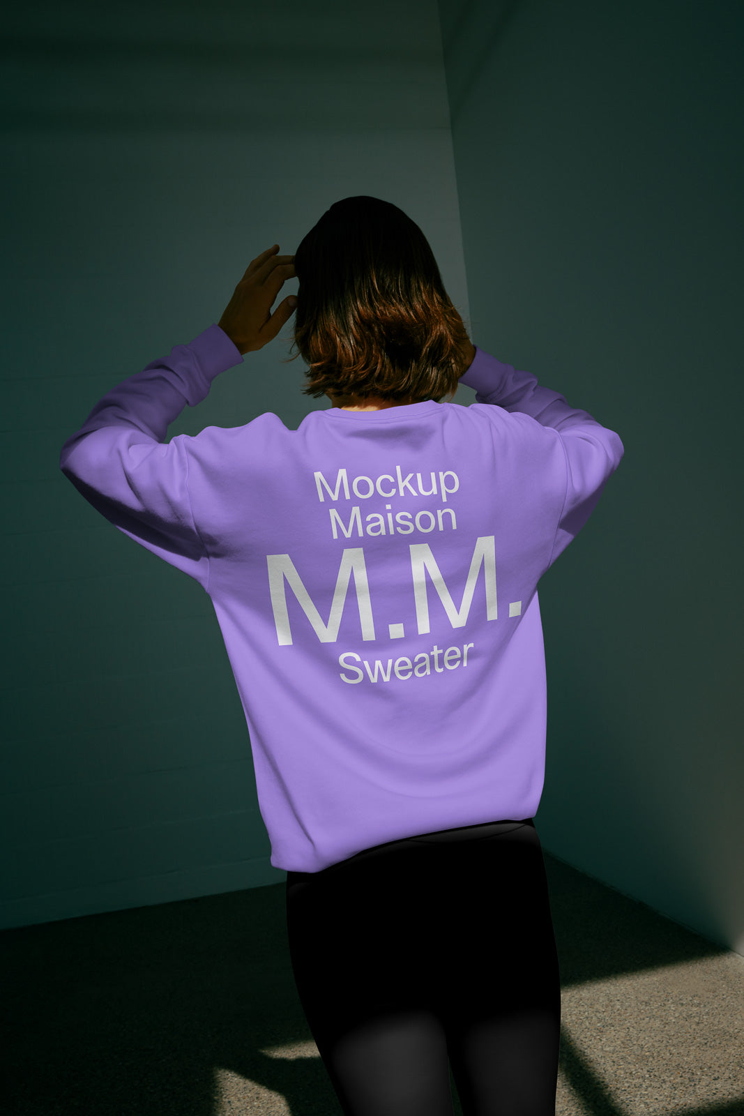 PSD mockup of a lavender sweater with "Mockup Maison M.M. Sweater" text on the back, worn in a softly lit space.