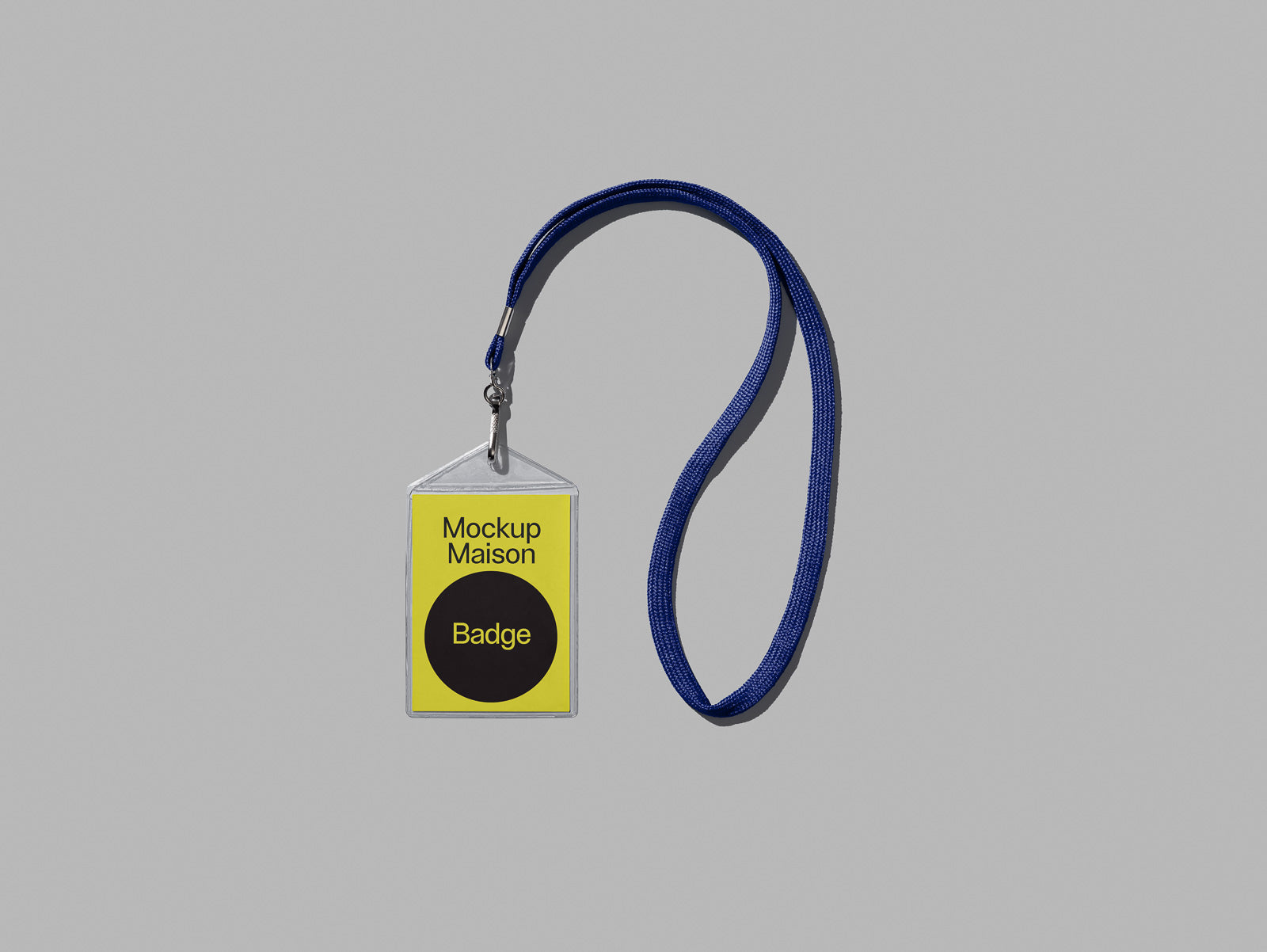 PSD mockup of a badge with a yellow label and dark circle labeled "Badge," attached to a blue lanyard on a gray background.