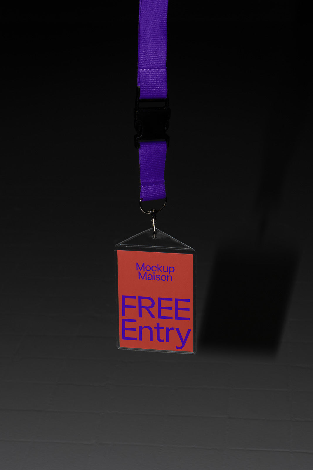 PSD mockup of a hanging ID badge with a purple lanyard, featuring "Mockup Maison" and "FREE Entry" text in purple on a red background.