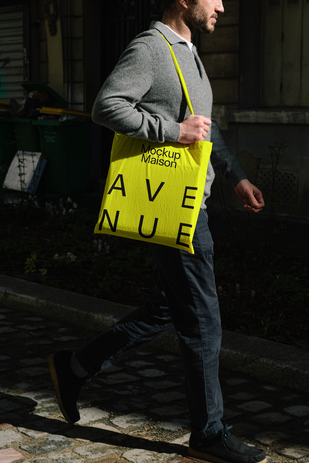 PSD mockup of a person walking with a vibrant yellow tote bag displaying bold typography, ideal for highlighting branding elements.