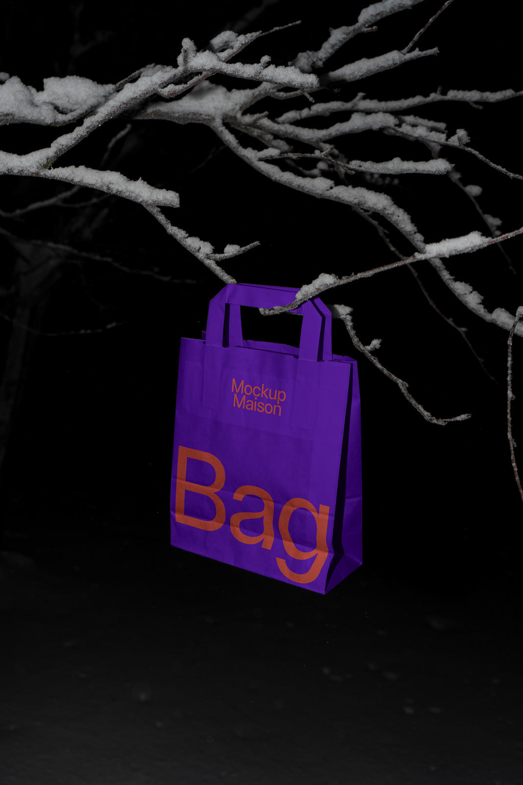 PSD mockup of a purple shopping bag with "Mockup Maison" and "Bag" text in orange, set against snowy branches at night.