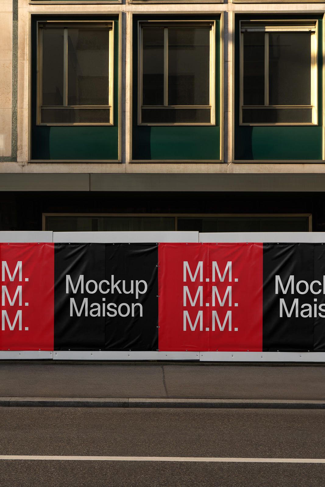 PSD mockup of a building facade featuring a banner with the text "Mockup Maison" and repeated "M.M." initials in a red and black design.