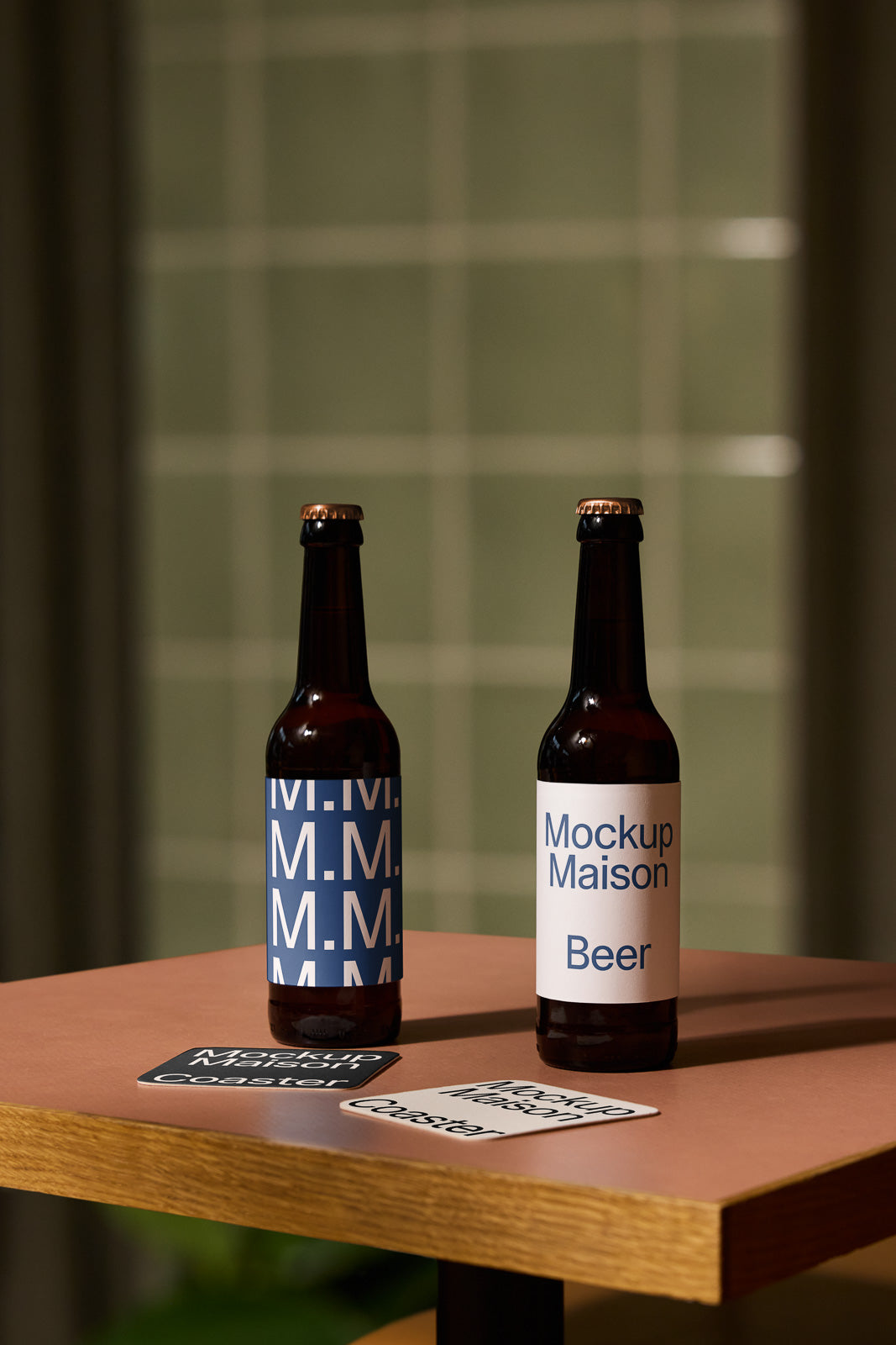 PSD mockup of two beer bottles on a wooden table, each with unique label designs, and two coasters placed nearby.