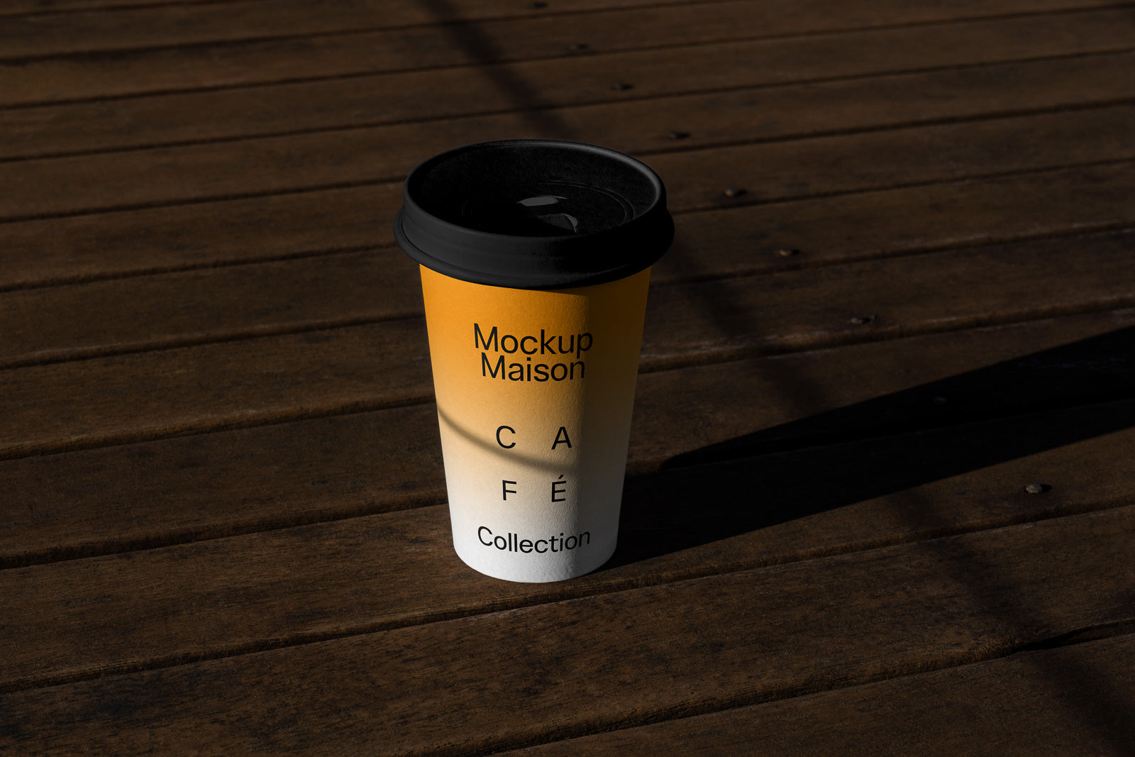 PSD mockup of a coffee cup with "Mockup Maison Café Collection" text, featuring a yellow-to-white gradient design, placed on a wooden surface.