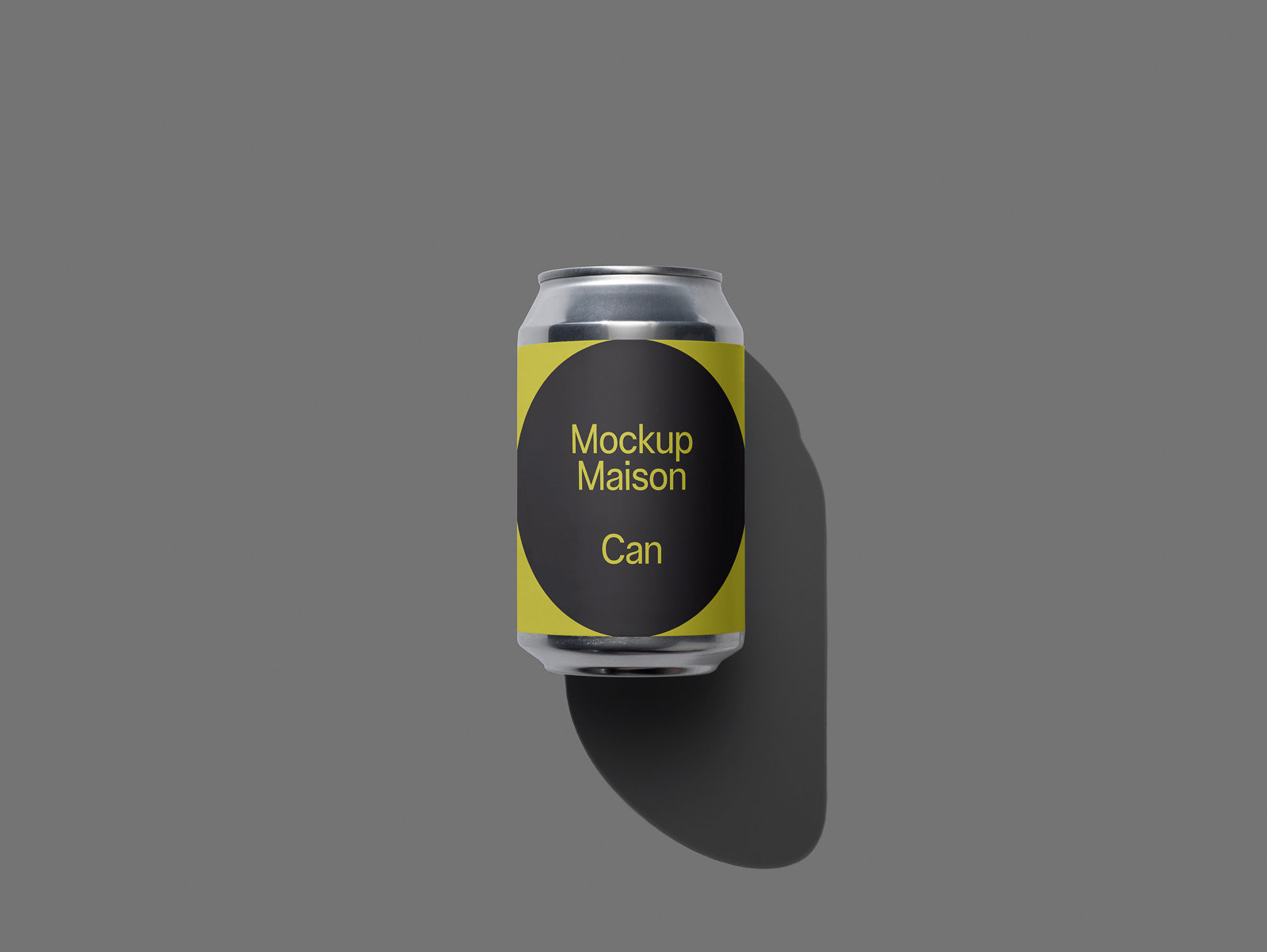 PSD mockup of a silver can with a yellow and black label reading "Mockup Maison Can" against a gray background.