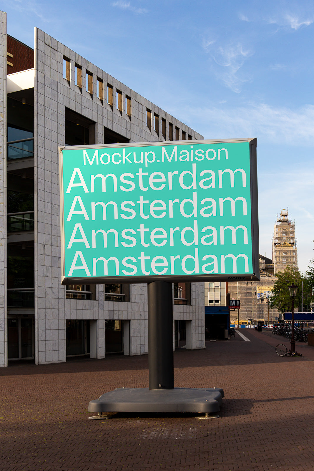 PSD mockup of a large outdoor billboard in an urban setting, featuring the word "Amsterdam" repeated in bold, white text on a turquoise background.