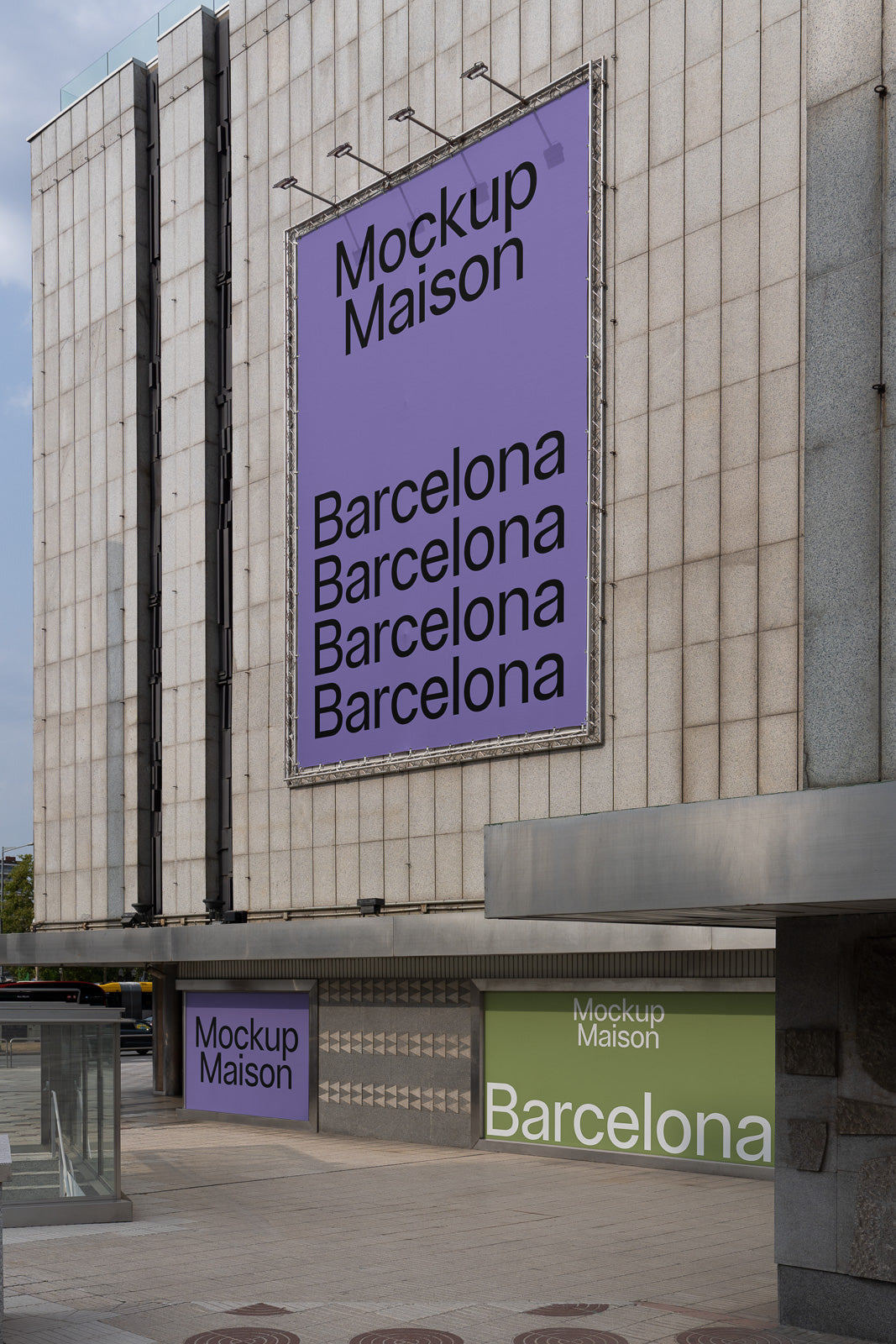 PSD mockup of a large outdoor banner and wall display on a modern building, featuring bold text saying "Mockup Maison" and "Barcelona" on a purple and green background.