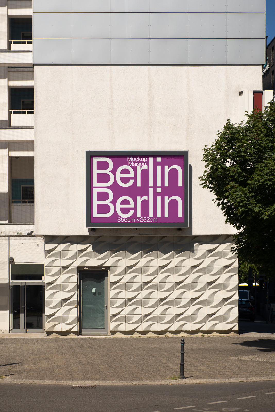 PSD mockup of a large purple billboard on a building facade, displaying text and dimensions, surrounded by geometric wall patterns and urban environment.