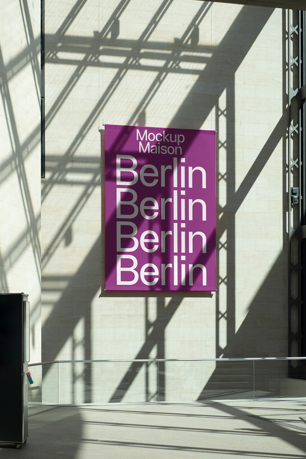 PSD mockup of a large vertical purple banner labeled "Mockup Maison" and "Berlin" repeated, hanging in a sunlit modern atrium.