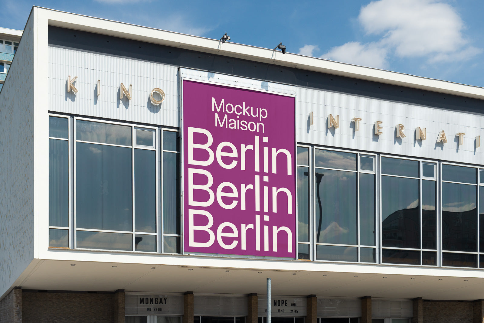 PSD mockup of a large vertical banner on a modern building exterior, featuring bold white text on a purple background with repetition of "Berlin."