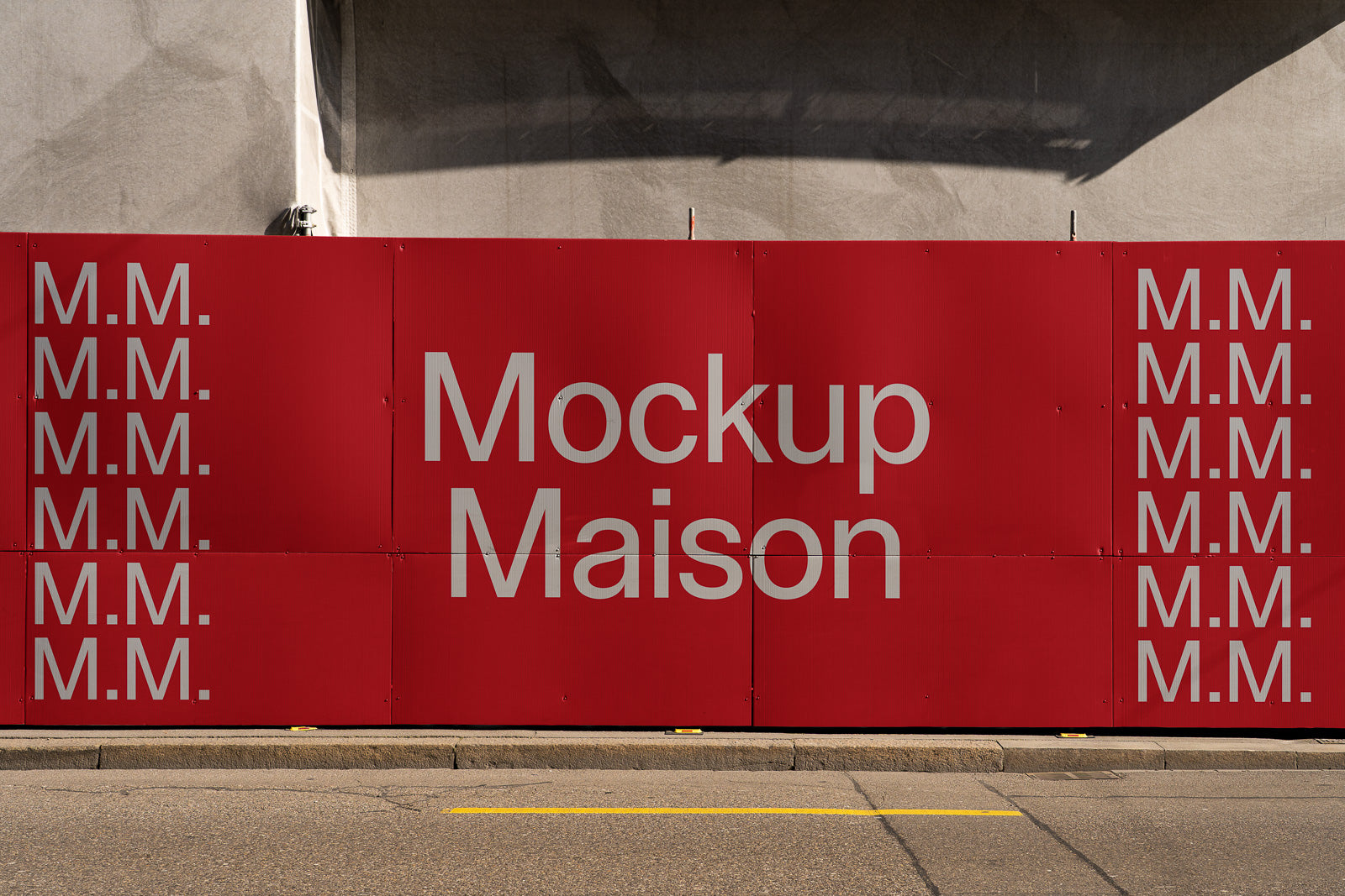 PSD mockup of a red construction barricade with "Mockup Maison" and "M.M." text, displaying a clean urban backdrop.