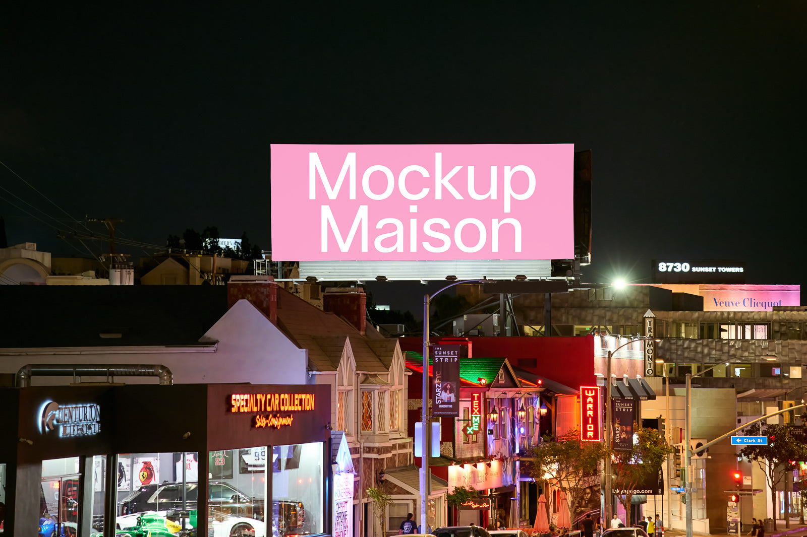 PSD mockup of a large billboard with pink background and white text "Mockup Maison" above a busy street illuminated by neon lights at night.