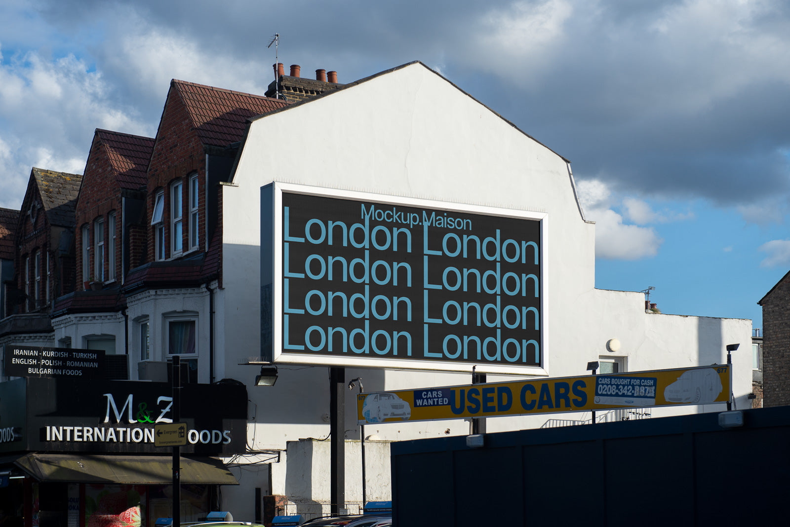 PSD mockup of an outdoor billboard on a building wall, displaying repeated text "London" in a blue font against a dark background, under a cloudy sky.