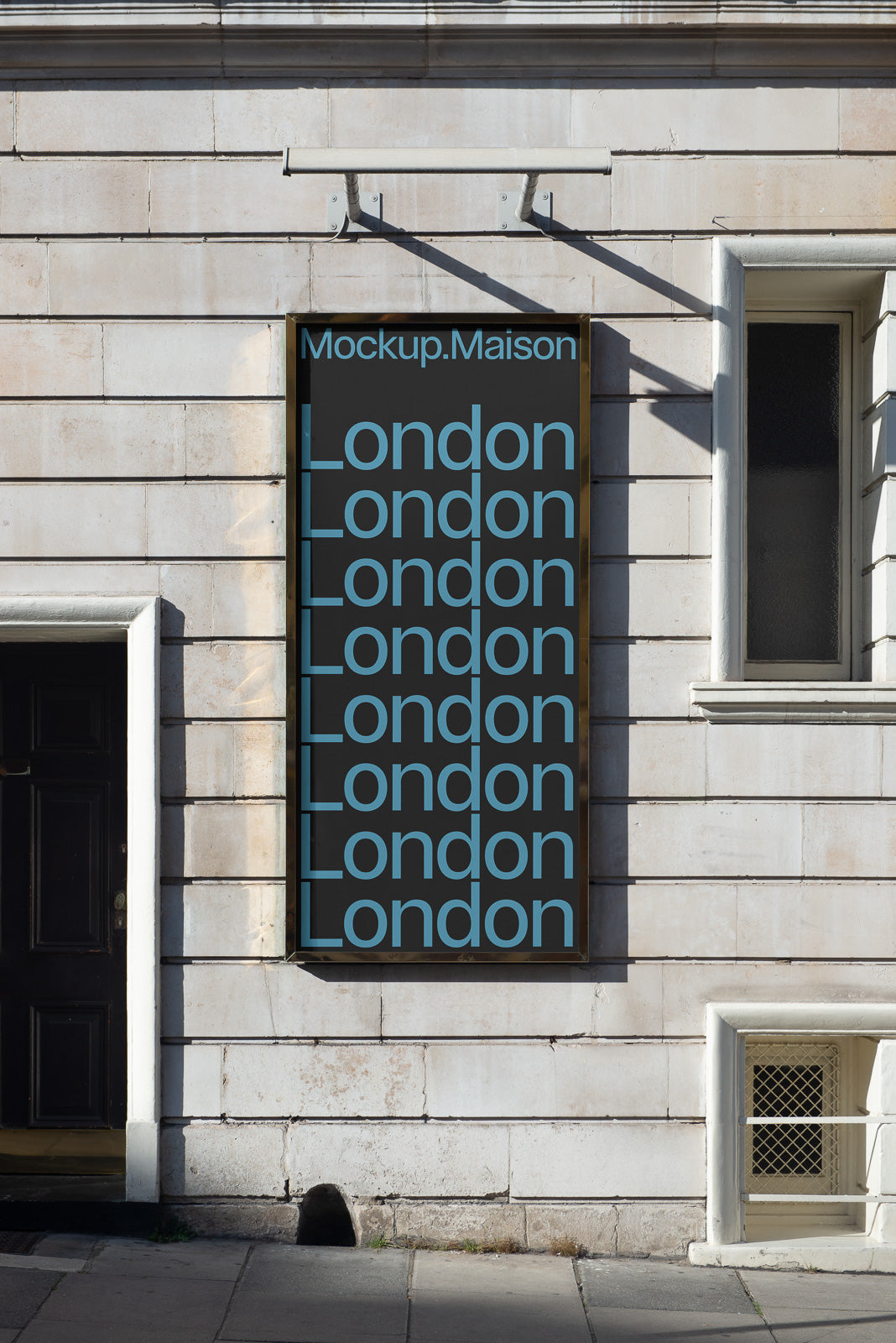PSD mockup of a street wall ad with repeated "London" text in light blue on a dark background, set against a beige stone building façade.