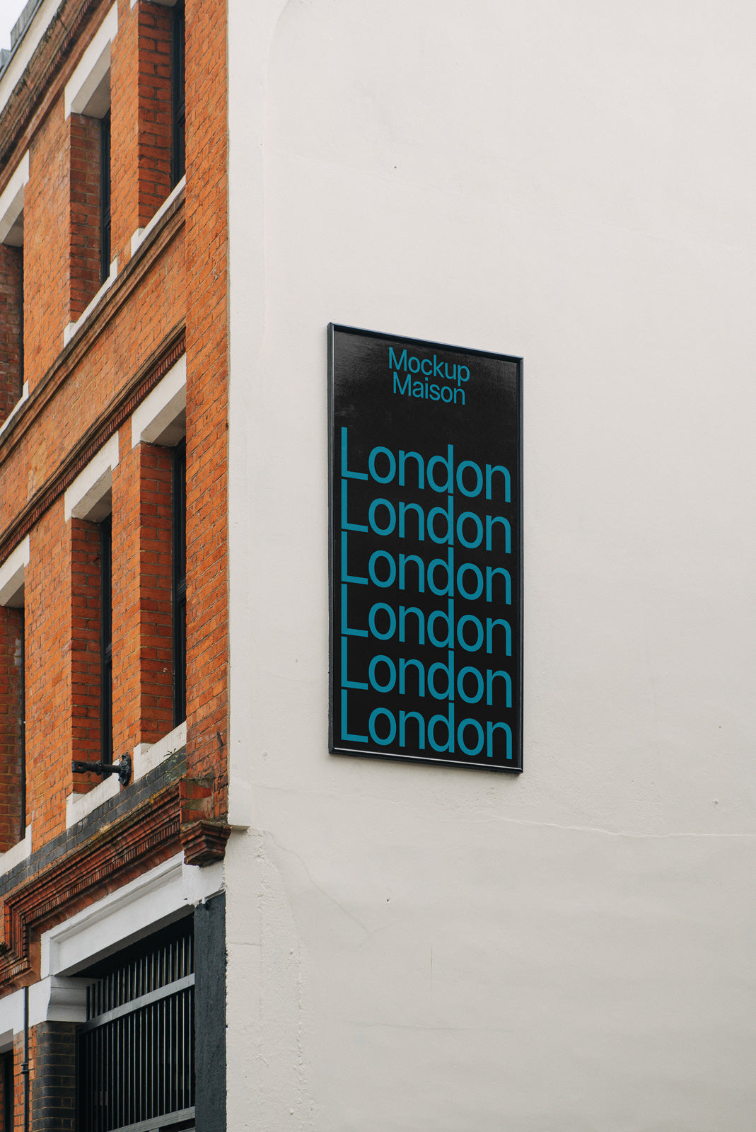 PSD mockup of a building facade with a black sign displaying the word "London" in blue text multiple times, set against a brick wall.