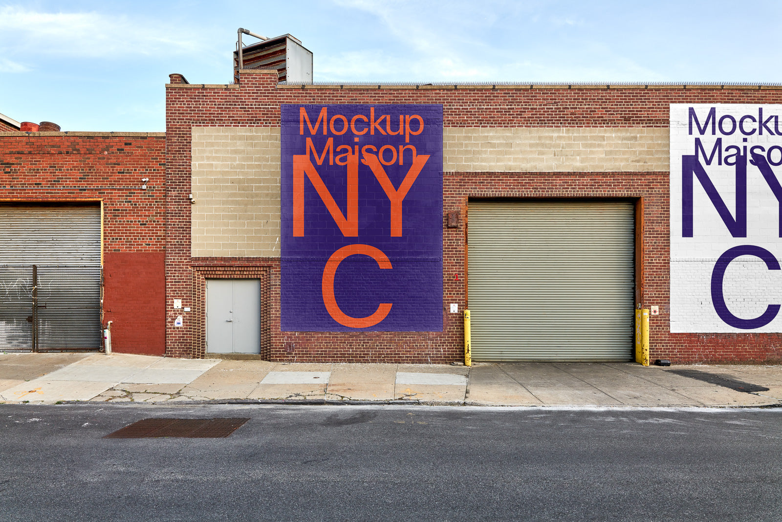 PSD mockup of a large outdoor wall with vibrant text reading "Mockup Maison NYC" in bold purple and orange letters on a brick industrial building.