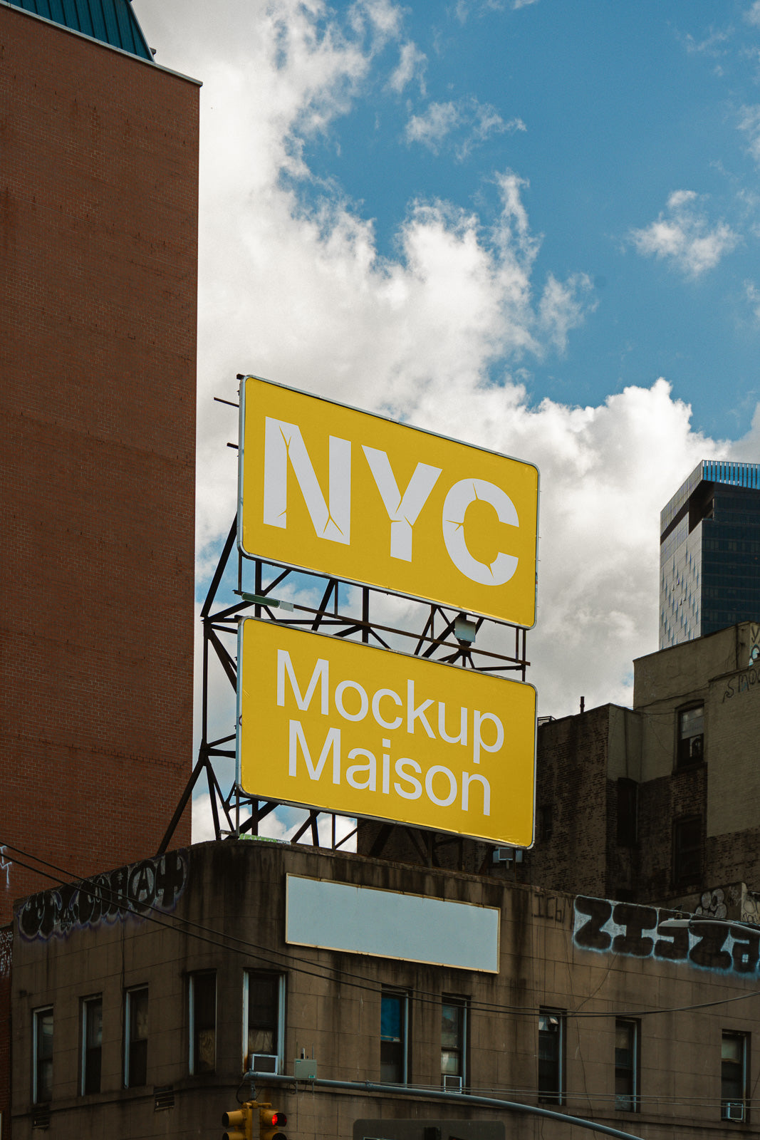 PSD mockup of a yellow billboard with "NYC" and "Mockup Maison" in white, set against a city skyline and blue sky with clouds.
