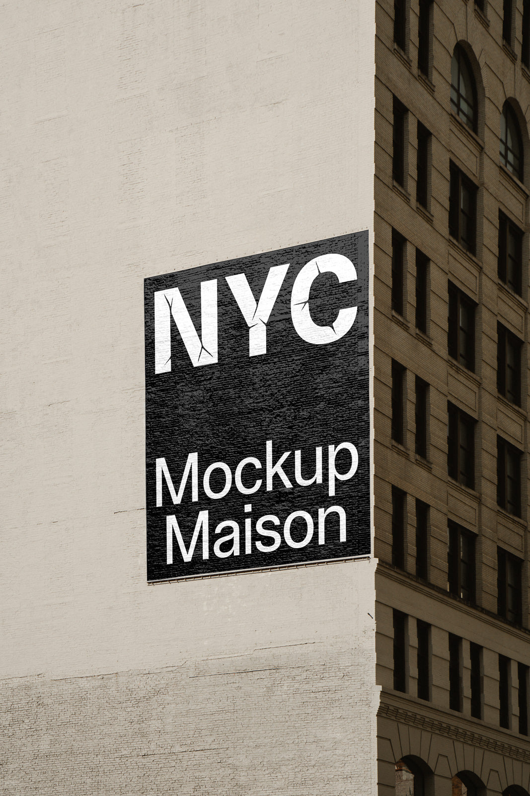 PSD mockup of a building façade displaying a large rectangular billboard with the text "NYC Mockup Maison" in bold letters against a textured urban background.
