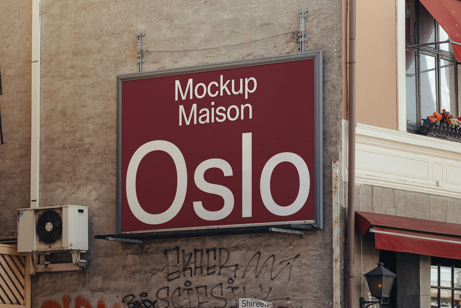 PSD mockup of an urban billboard on a textured wall with air conditioning unit nearby, displaying "Mockup Maison Oslo" in large white text on a red background.