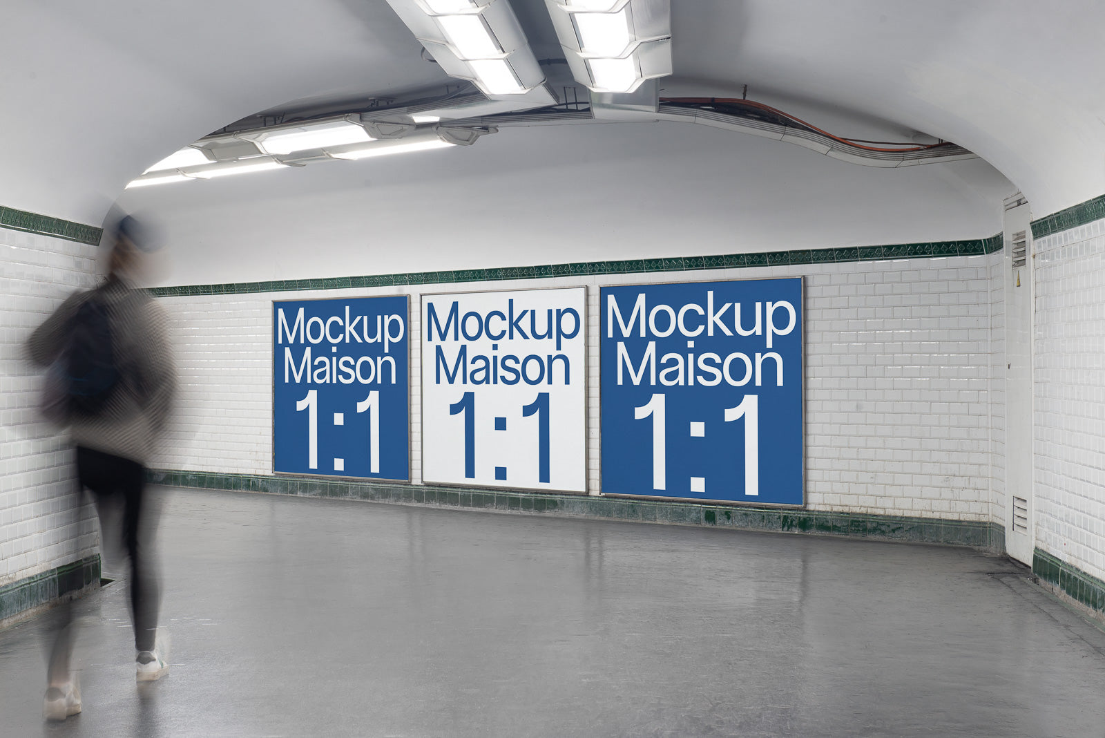 PSD mockup of three large billboard posters in an underground corridor with blurred pedestrian walking past, showcasing "Mockup Maison 1:1".