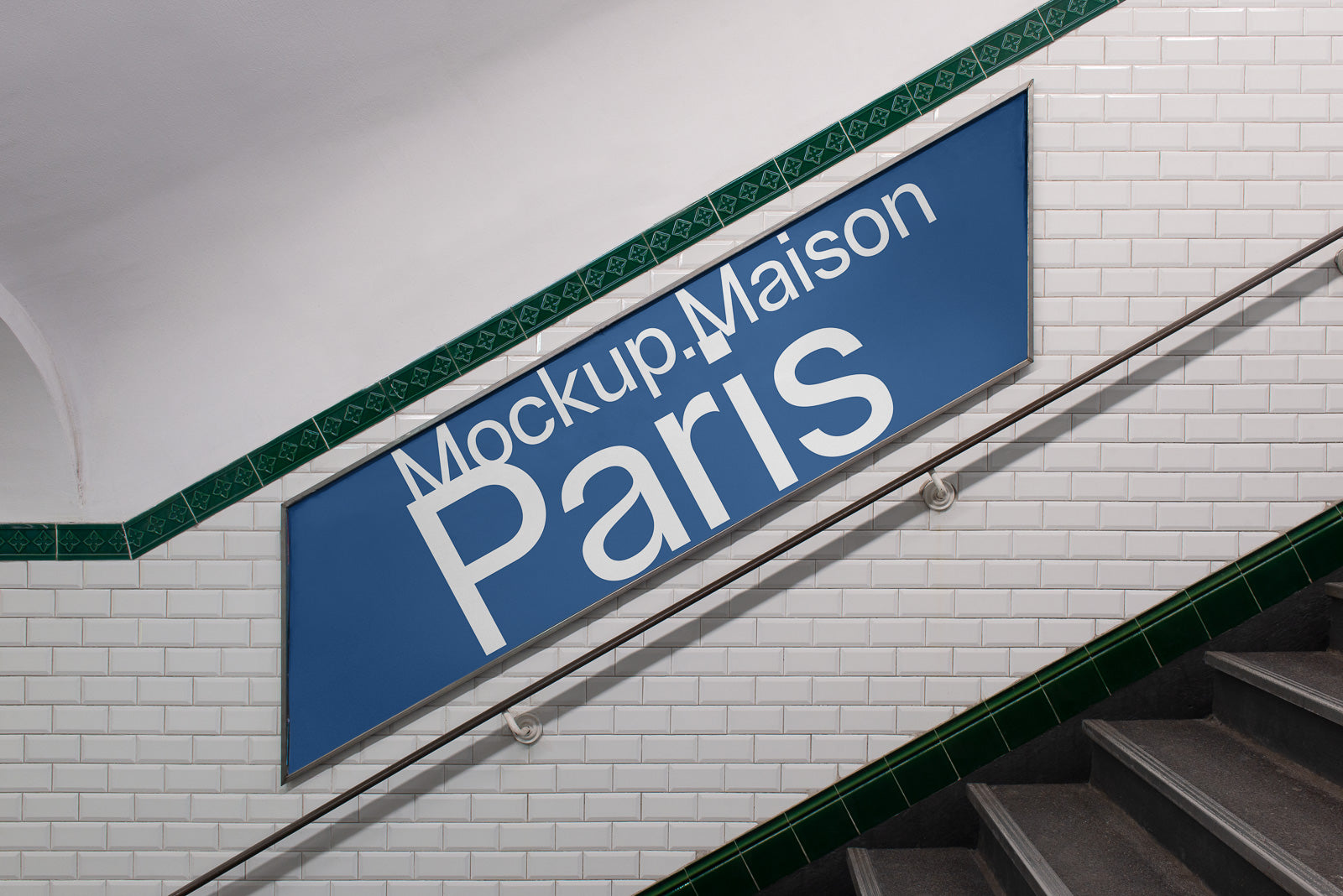 PSD mockup of a large blue sign reading "Mockup Maison Paris" mounted on a white tiled wall beside a staircase with green trim details.