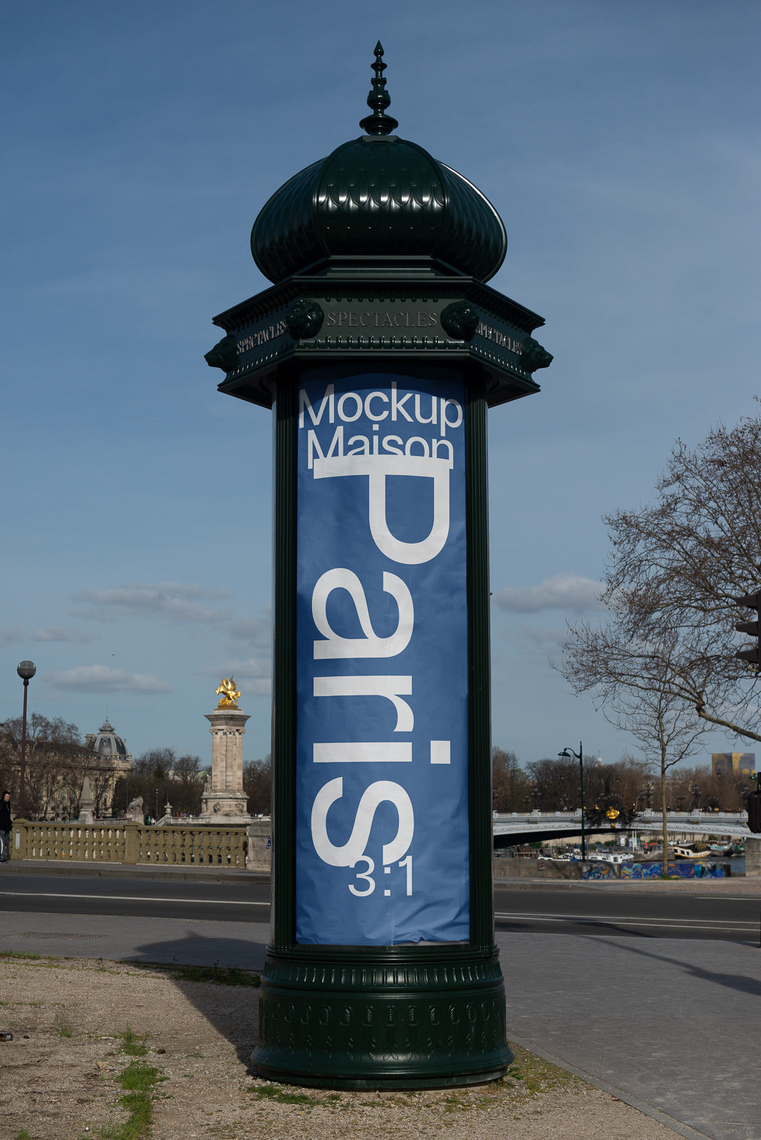 PSD mockup of a large blue banner on a green cylindrical pillar with a Parisian street in the background, featuring sky and distant architecture.