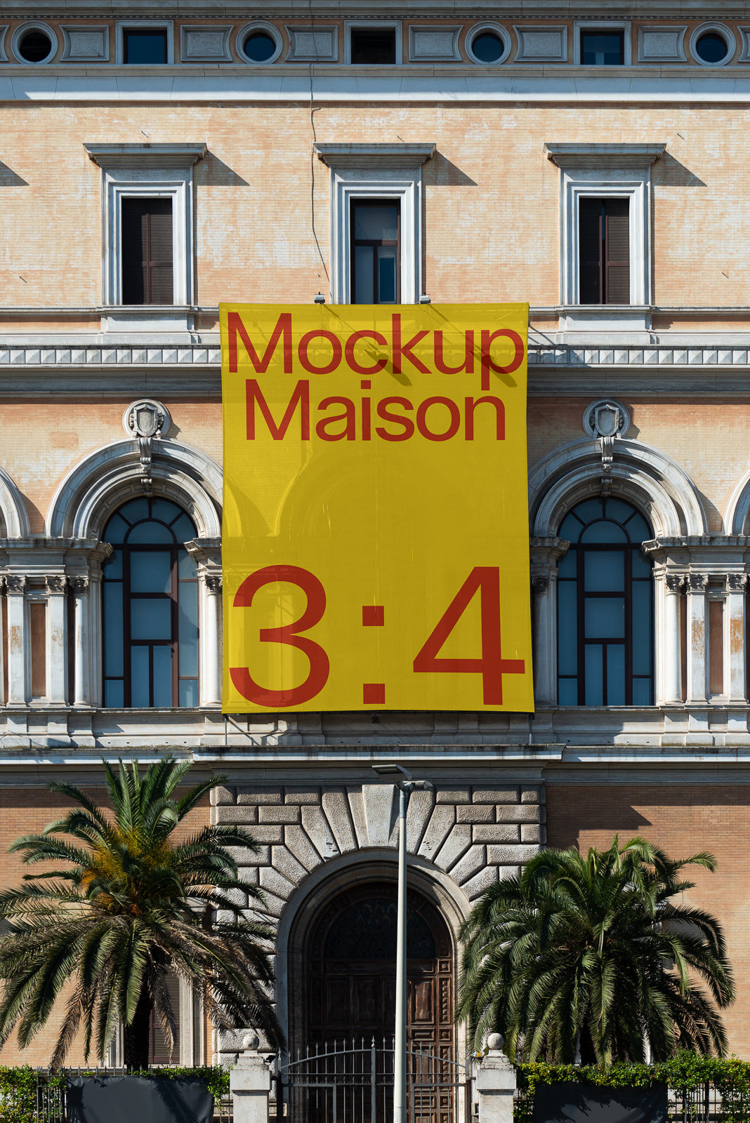 PSD mockup featuring a large yellow banner with red text "Mockup Maison 3:4" hanging on the facade of a classic building.