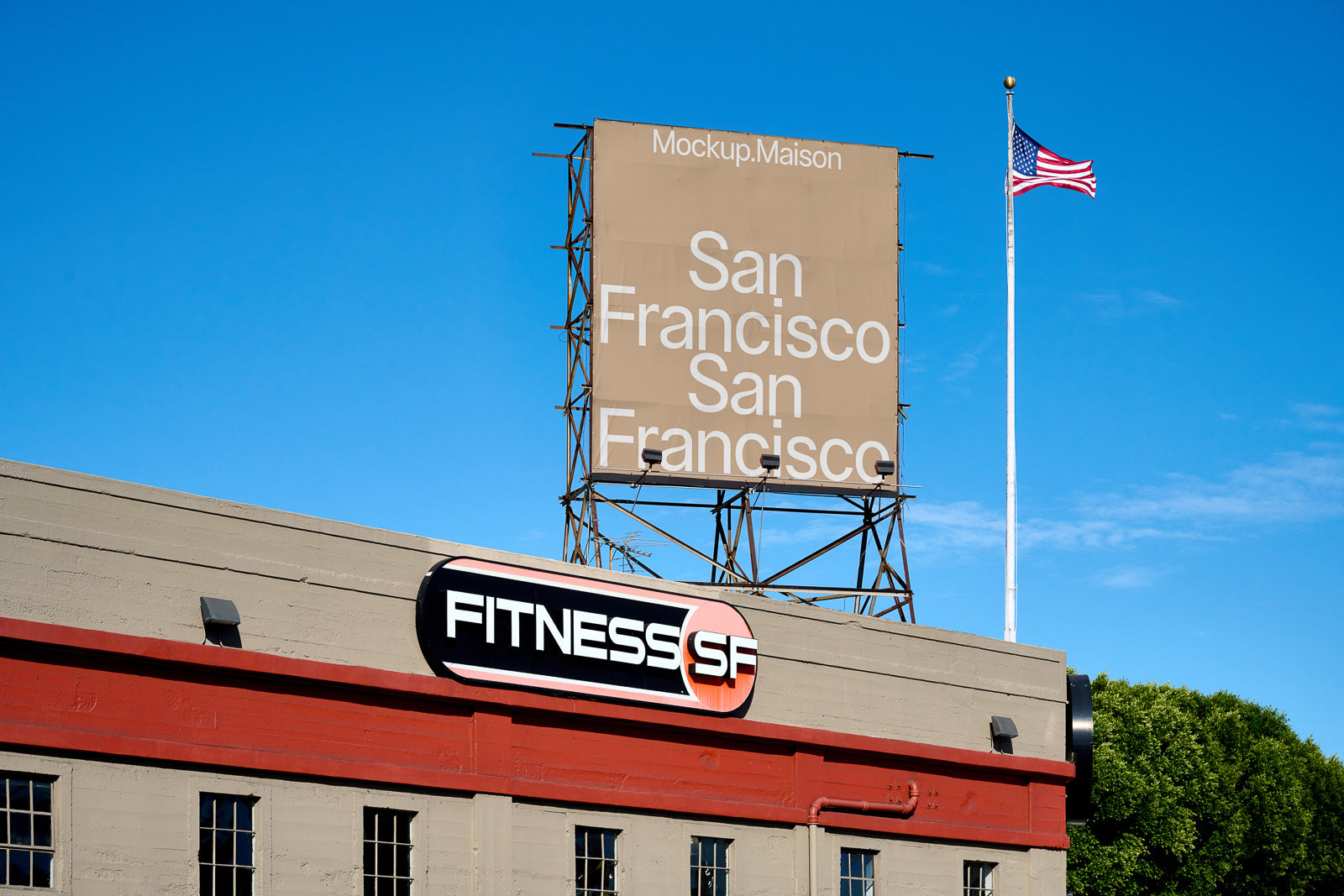 PSD mockup of a building exterior featuring a large billboard reading "San Francisco" multiple times, with an American flag and clear blue sky in the background.