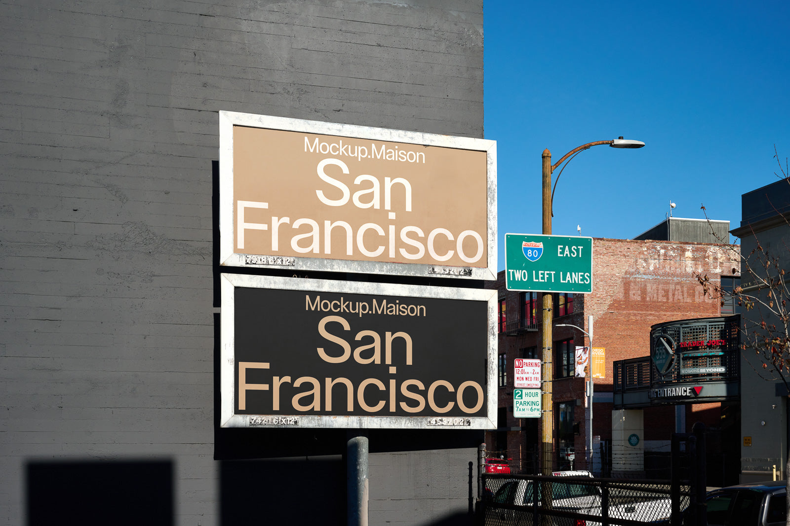 PSD mockup of two street billboards on a city wall, one with a beige design and the other with a black design, both labeled San Francisco.