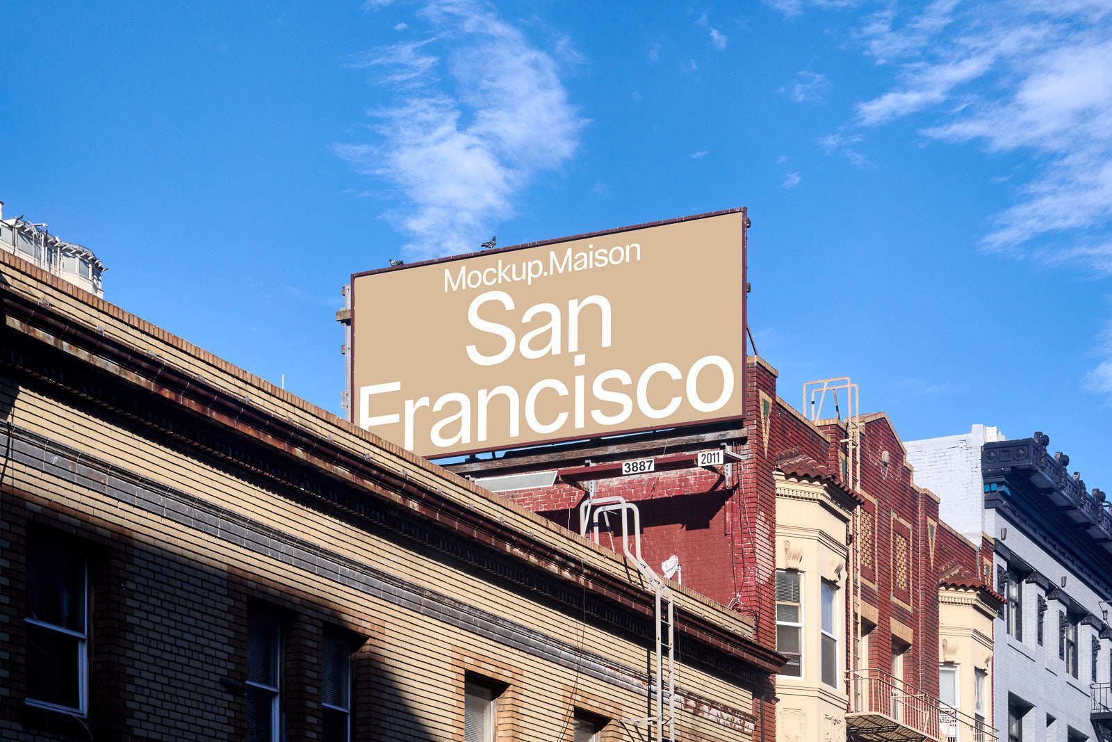 PSD mockup of a large outdoor billboard mounted on urban buildings with blue sky background, featuring the text "San Francisco" in bold white letters.