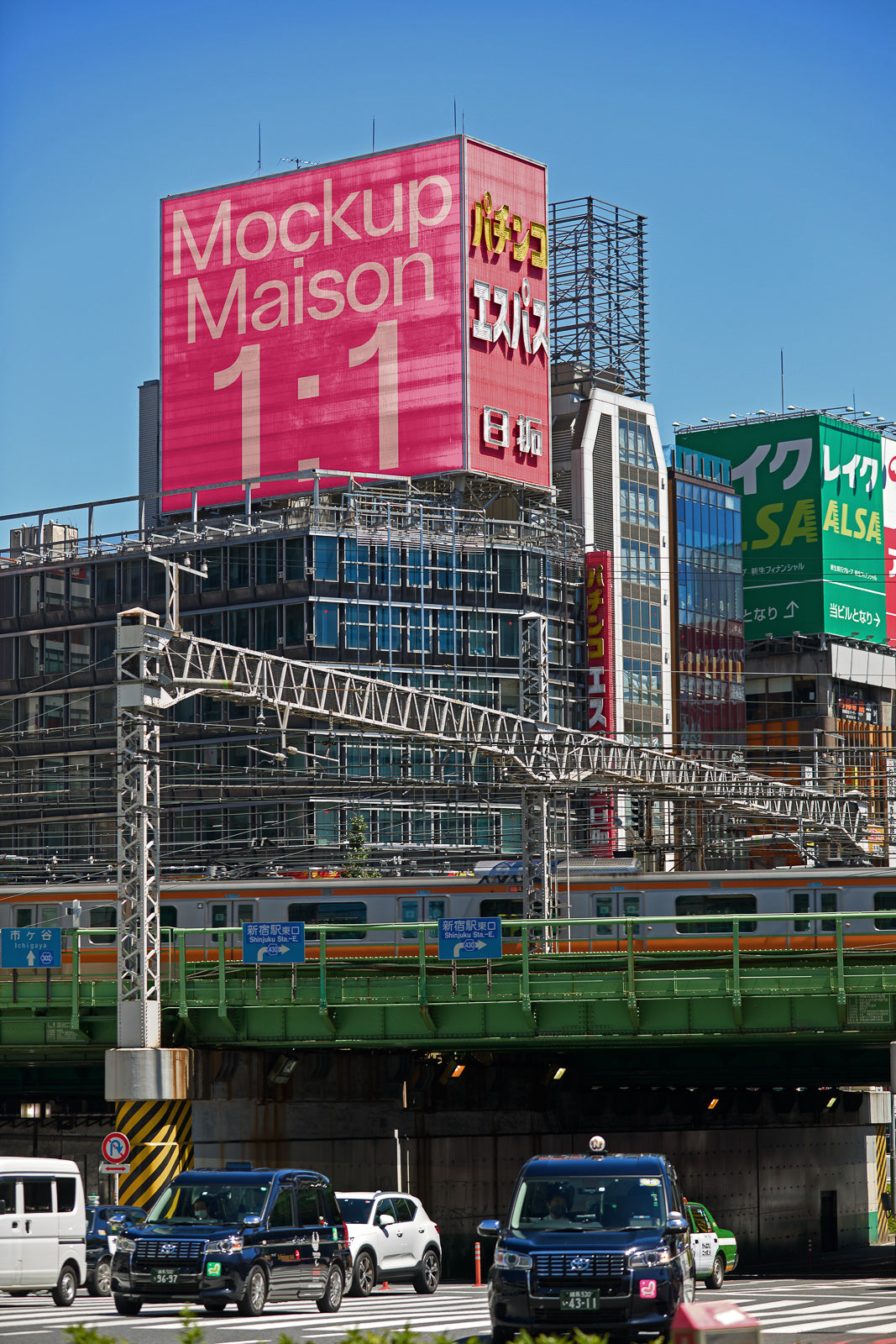 PSD mockup of a large pink billboard on a city building above a bustling street with cars and a train on an elevated track.