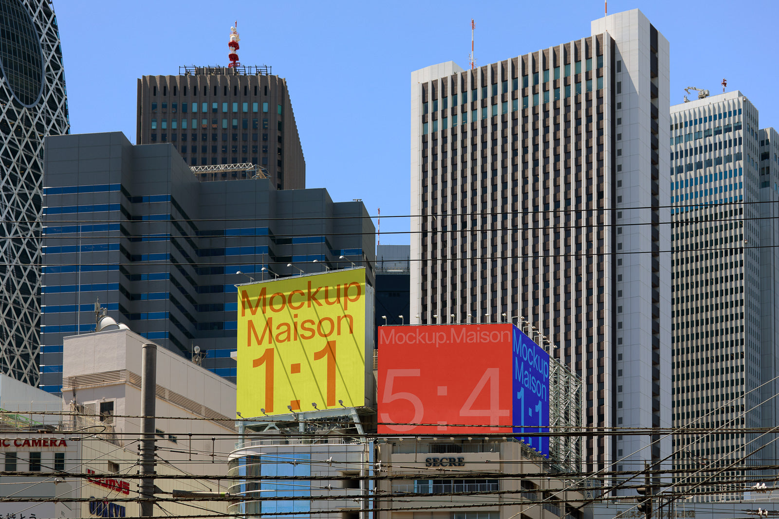 PSD mockup of urban billboards with yellow, red, and blue designs against a cityscape of modern high-rise buildings under a clear sky.