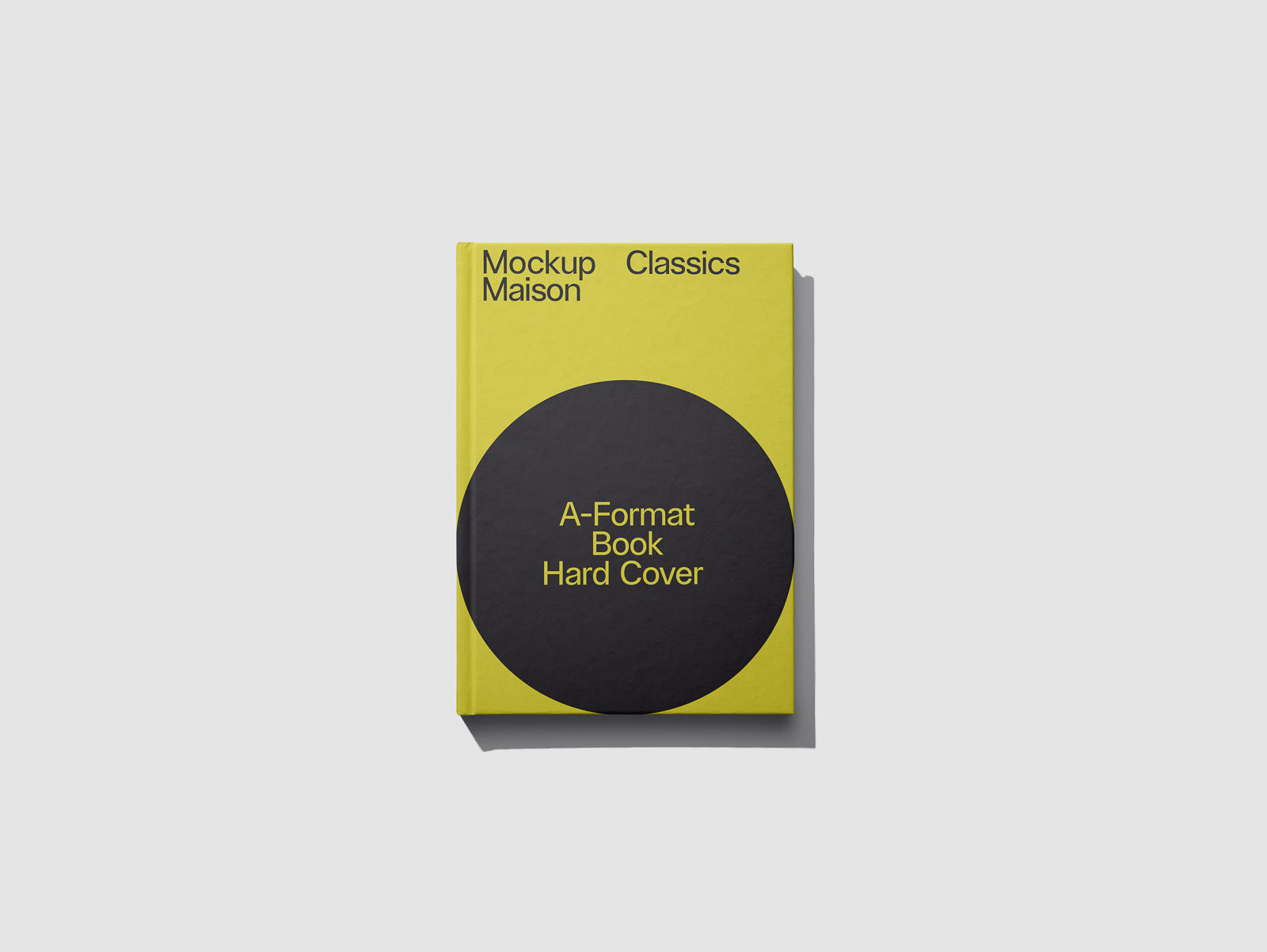 PSD mockup of a yellow hardcover book with a black circle design, labeled "A-Format Book Hard Cover" and "Mockup Maison Classics" on the cover.