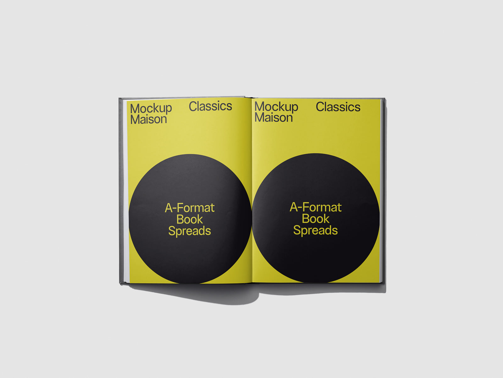 PSD mockup of an open book with a yellow background and two black circles labeled "A-Format Book Spreads" for layout visualization.