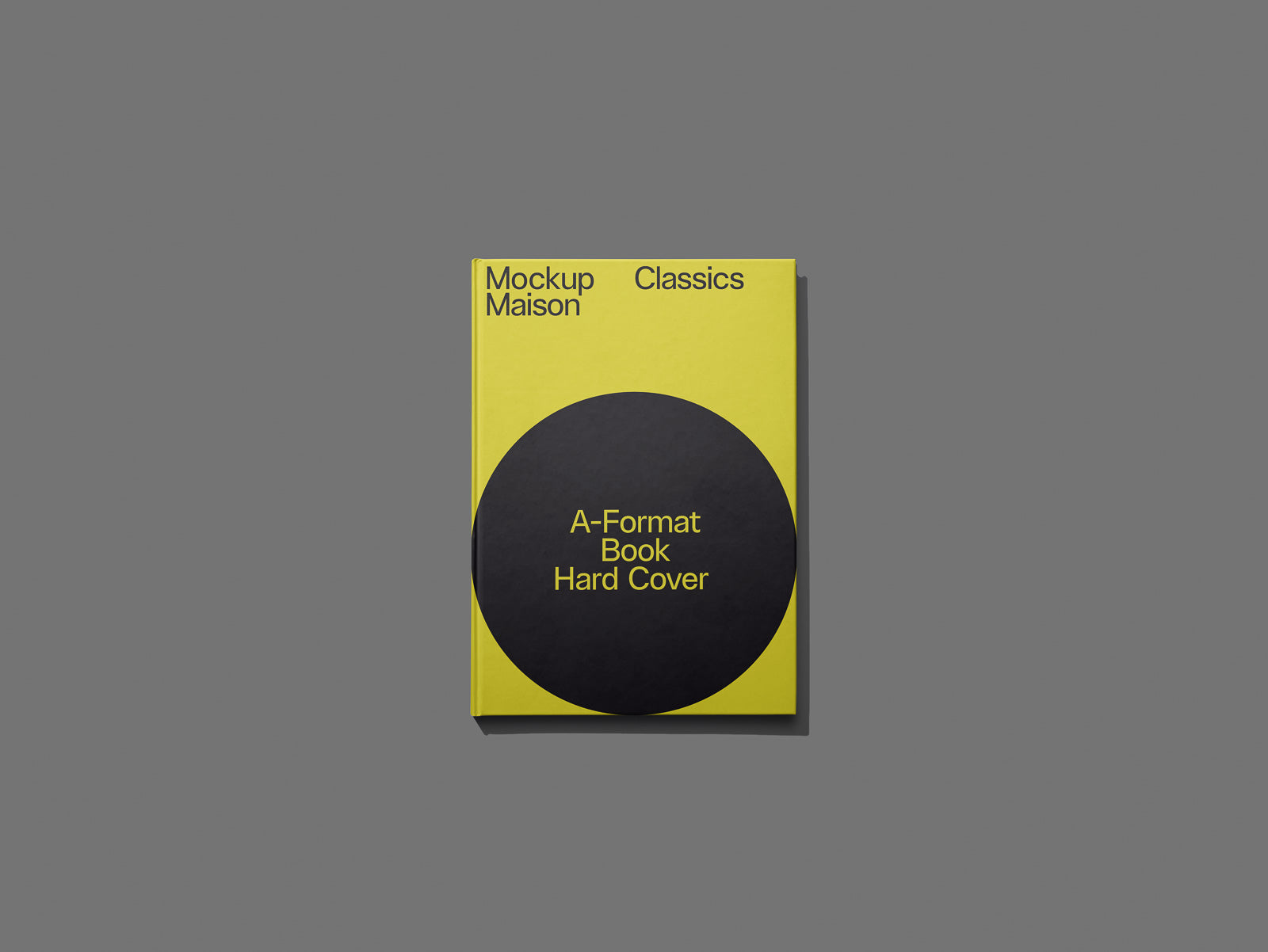 PSD mockup of a yellow hardcover book titled "A-Format Book Hard Cover" with a black circle design against a gray background.