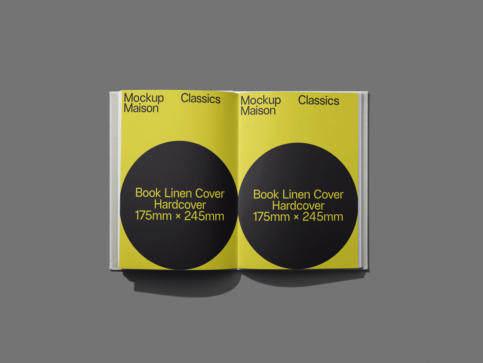 PSD mockup of an open book with yellow pages and black circles displaying text about book dimensions and linen hardcover, set against a gray background.