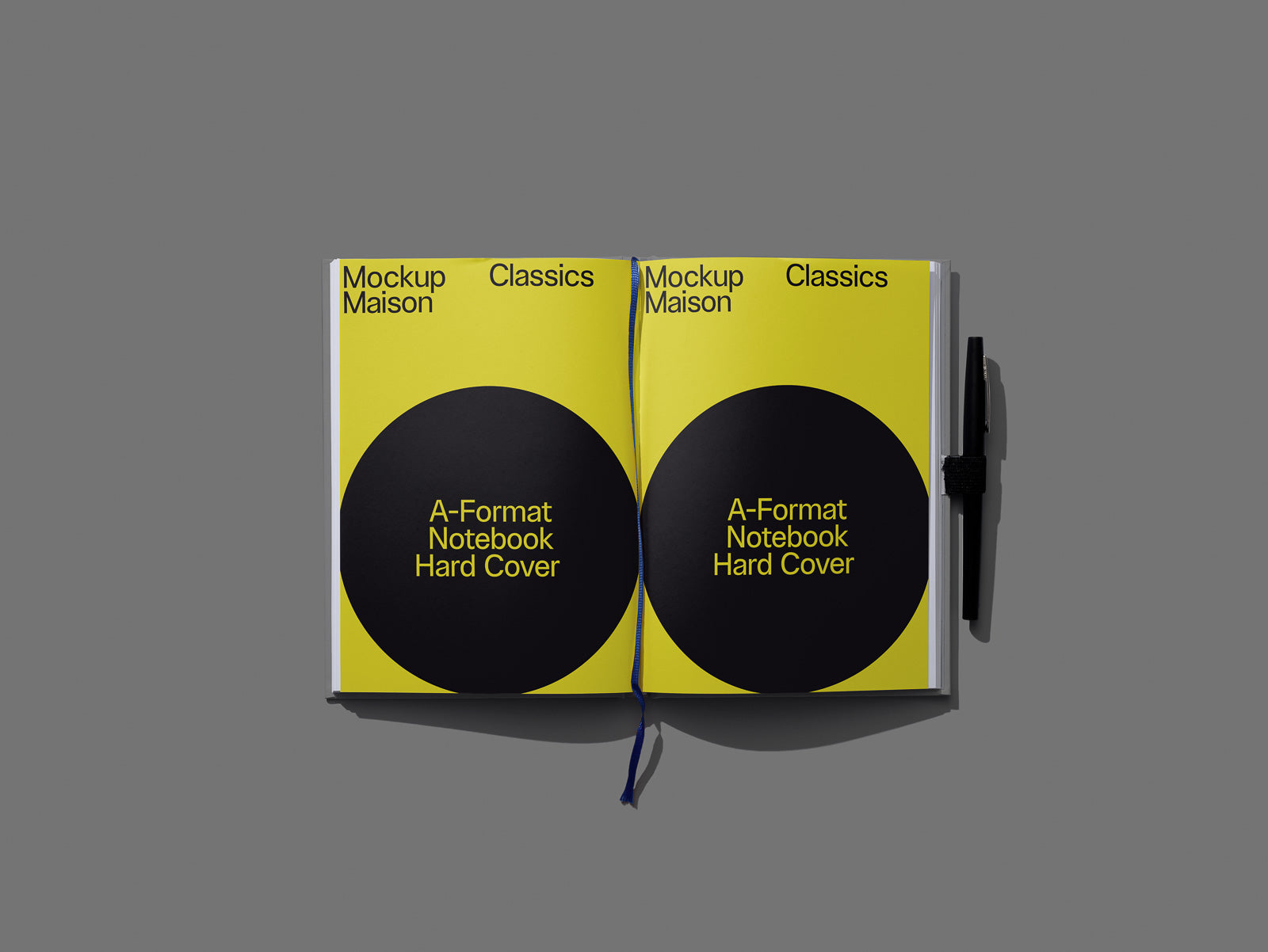 PSD mockup of an open notebook with a yellow cover and black circular design labeled "A-Format Notebook Hard Cover," pen placed on the right.