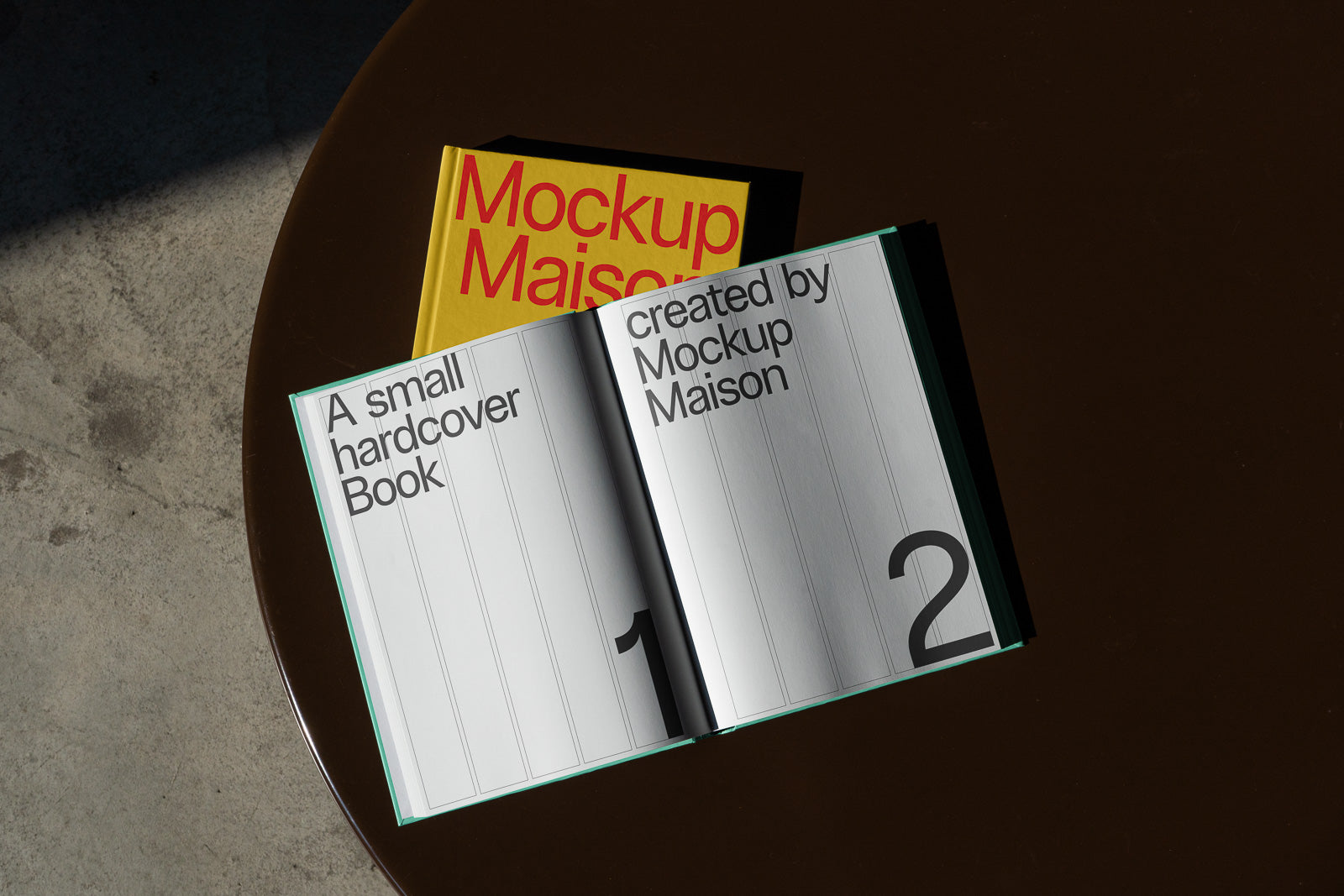 PSD mockup of an open book displaying pages with large numbers and minimal text, set on a round dark table, with a closed book underneath.