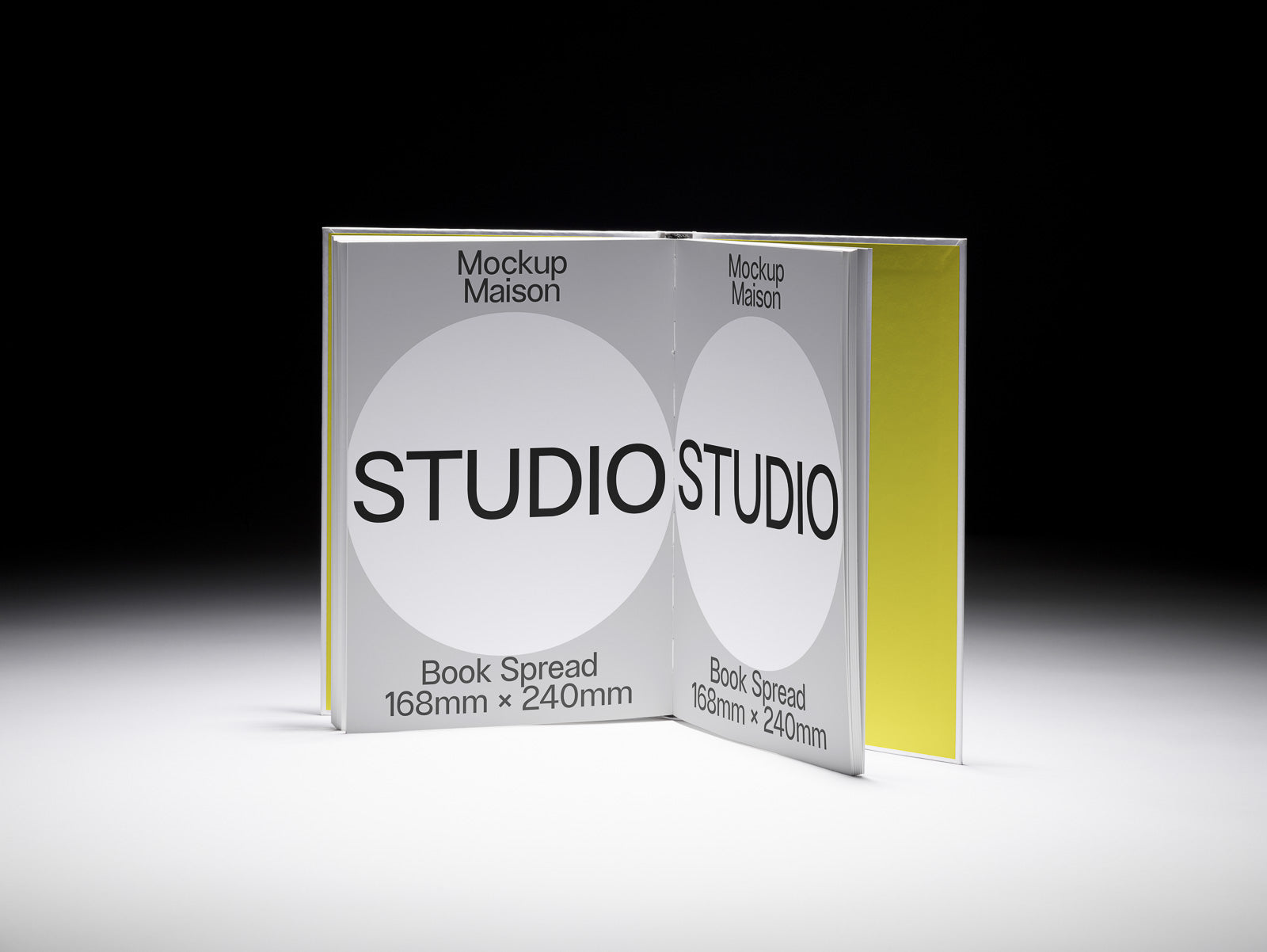 PSD mockup of an open book spread with "Studio" text on both pages, displaying dimensions 168mm x 240mm and showcasing a minimalist design on a dark background.
