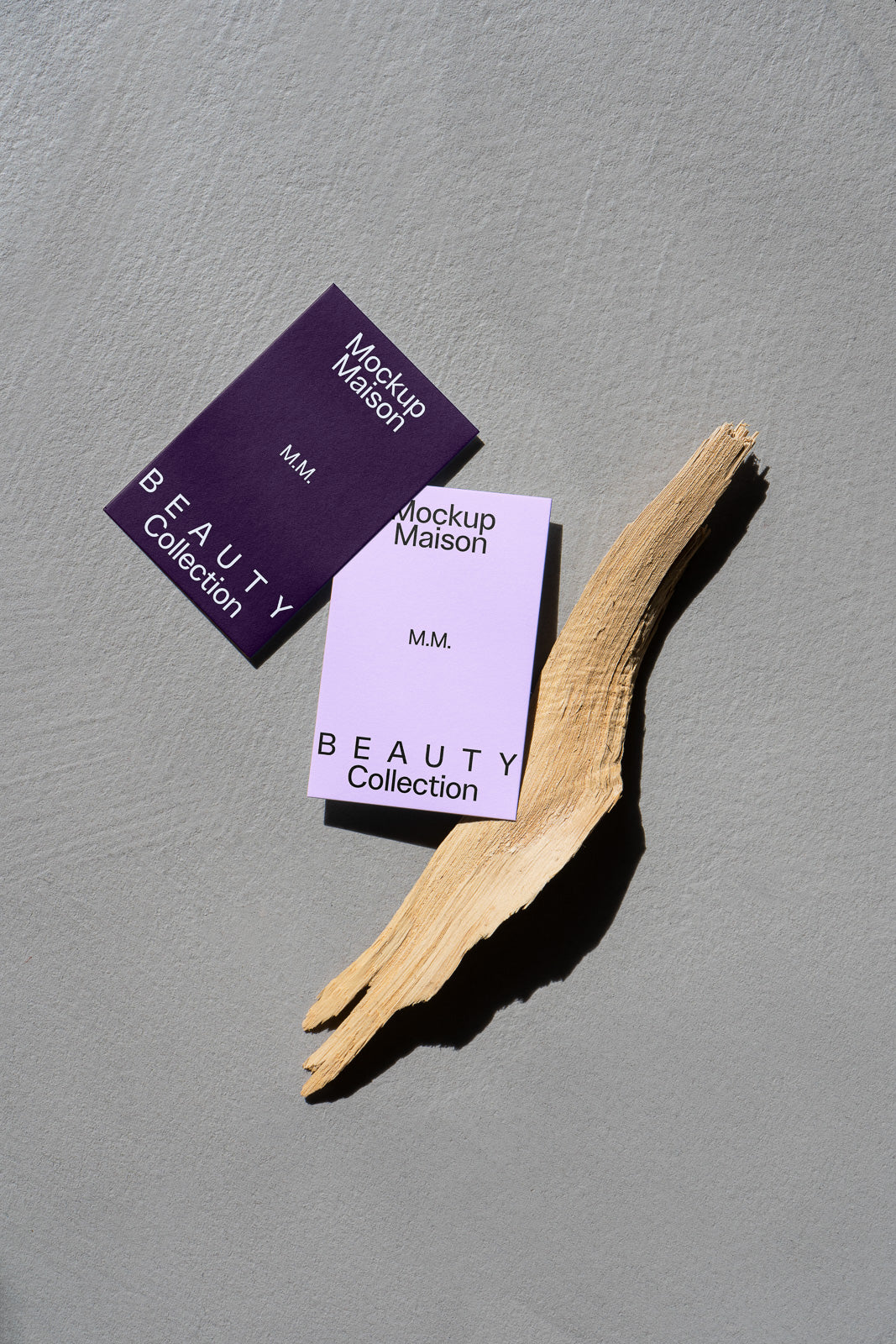 PSD mockup of two beauty collection cards in purple tones with decorative wood on a textured gray background.