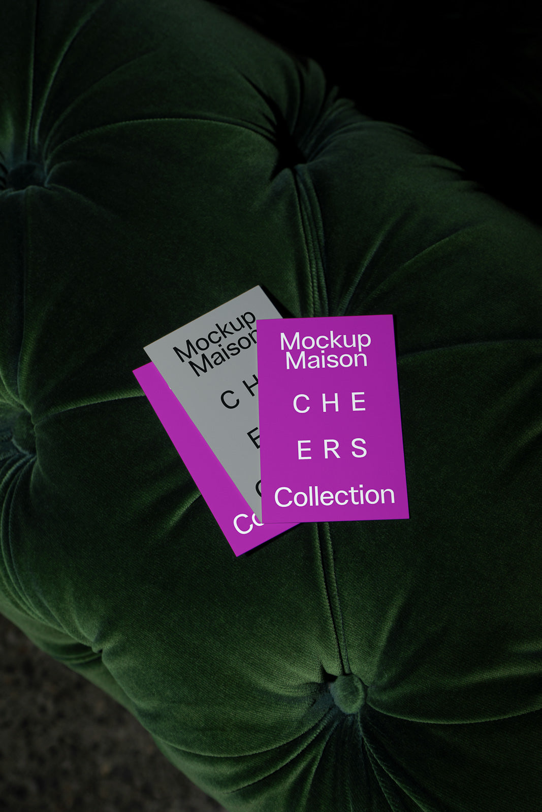PSD mockup of two CHERS Collection cards resting on a textured dark green cushion, with one card in grey and one in purple.