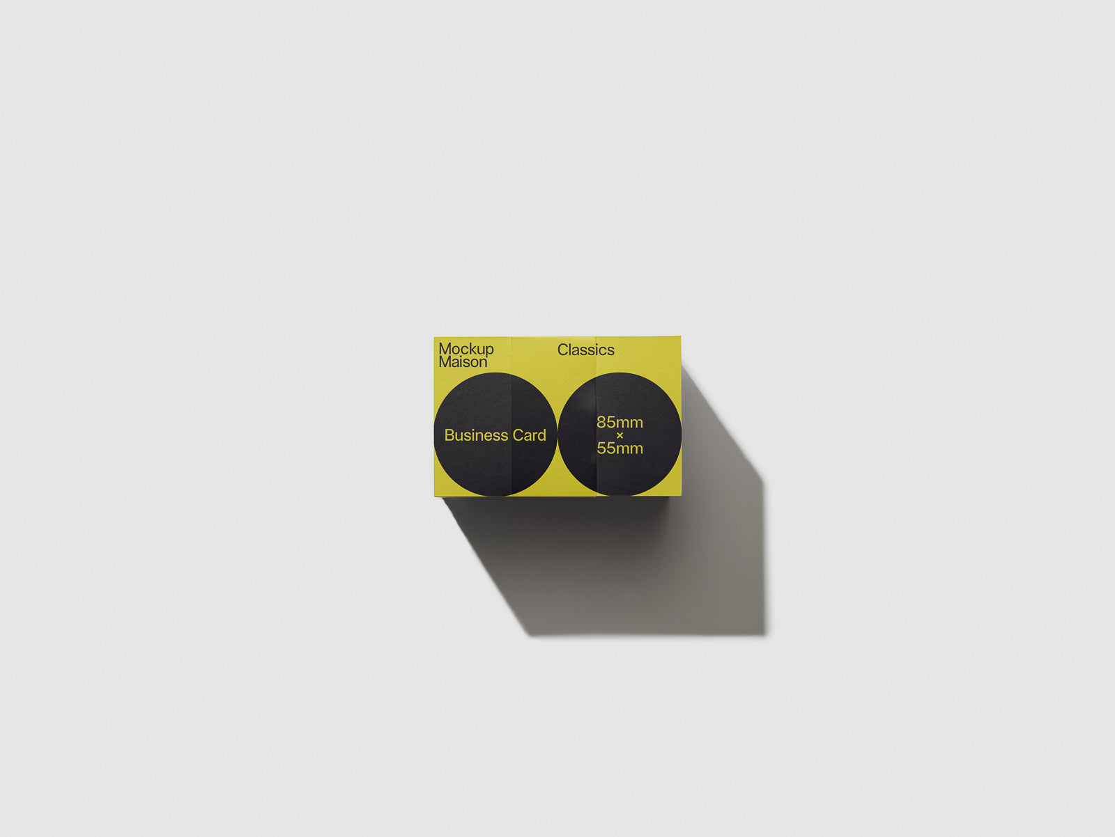 PSD mockup of a business card box with a yellow and black design, labeled "Mockup Maison Classics," displaying dimensions 85mm x 55mm.