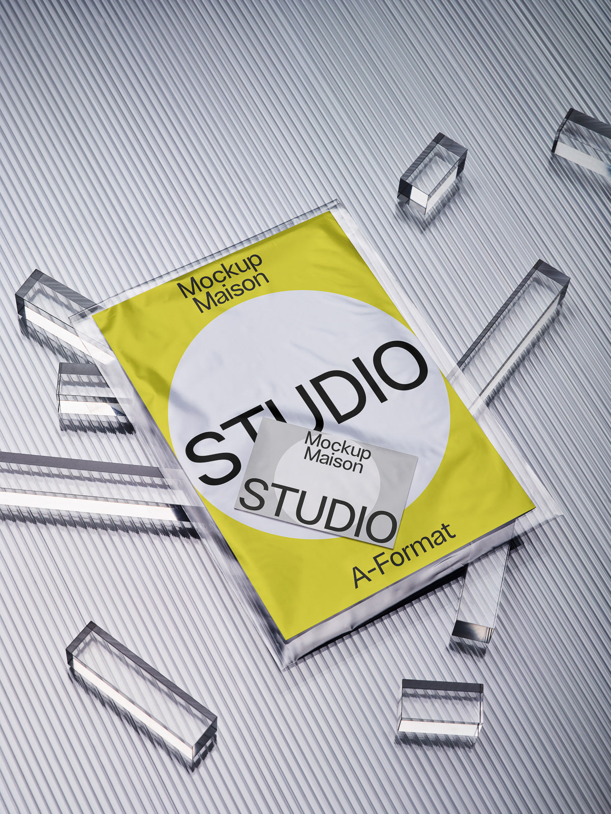 PSD mockup of a poster with yellow and white background, displaying text "Studio" and "A-Format", lying on a reflective surface surrounded by transparent prisms.