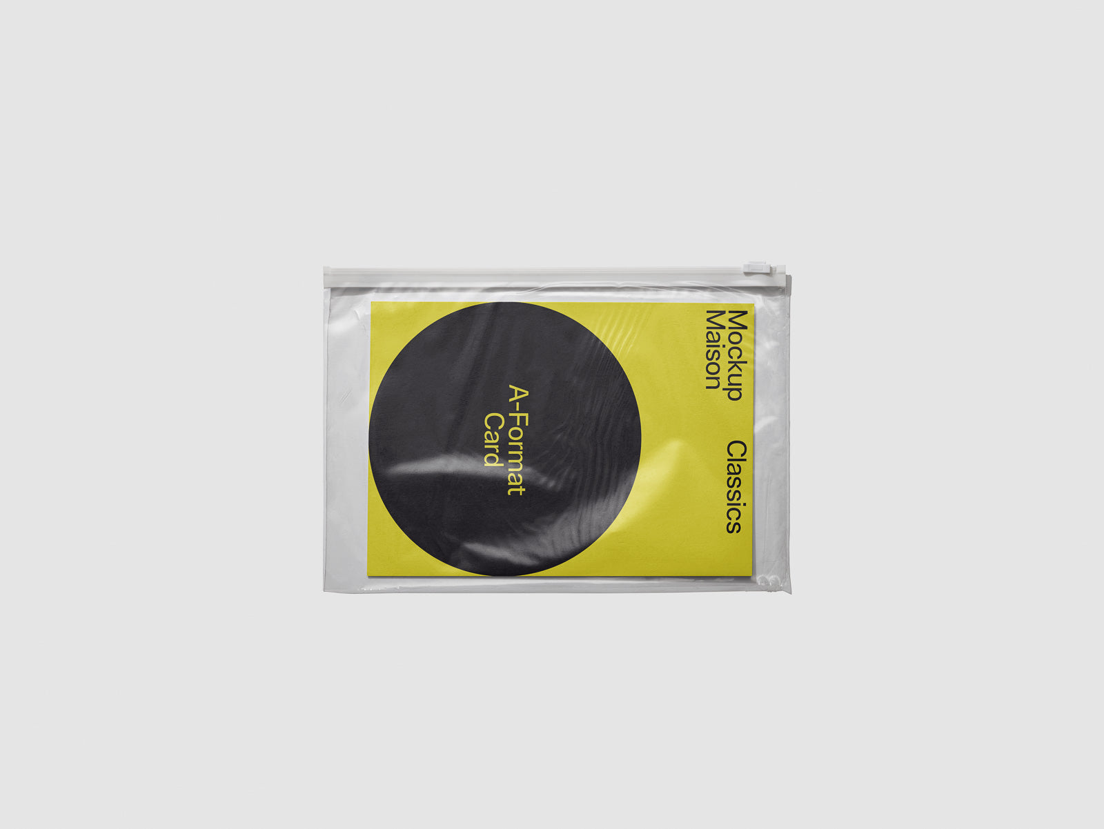 PSD mockup of a yellow A-format card in a transparent plastic wrapper, featuring bold black text and a large circle design.