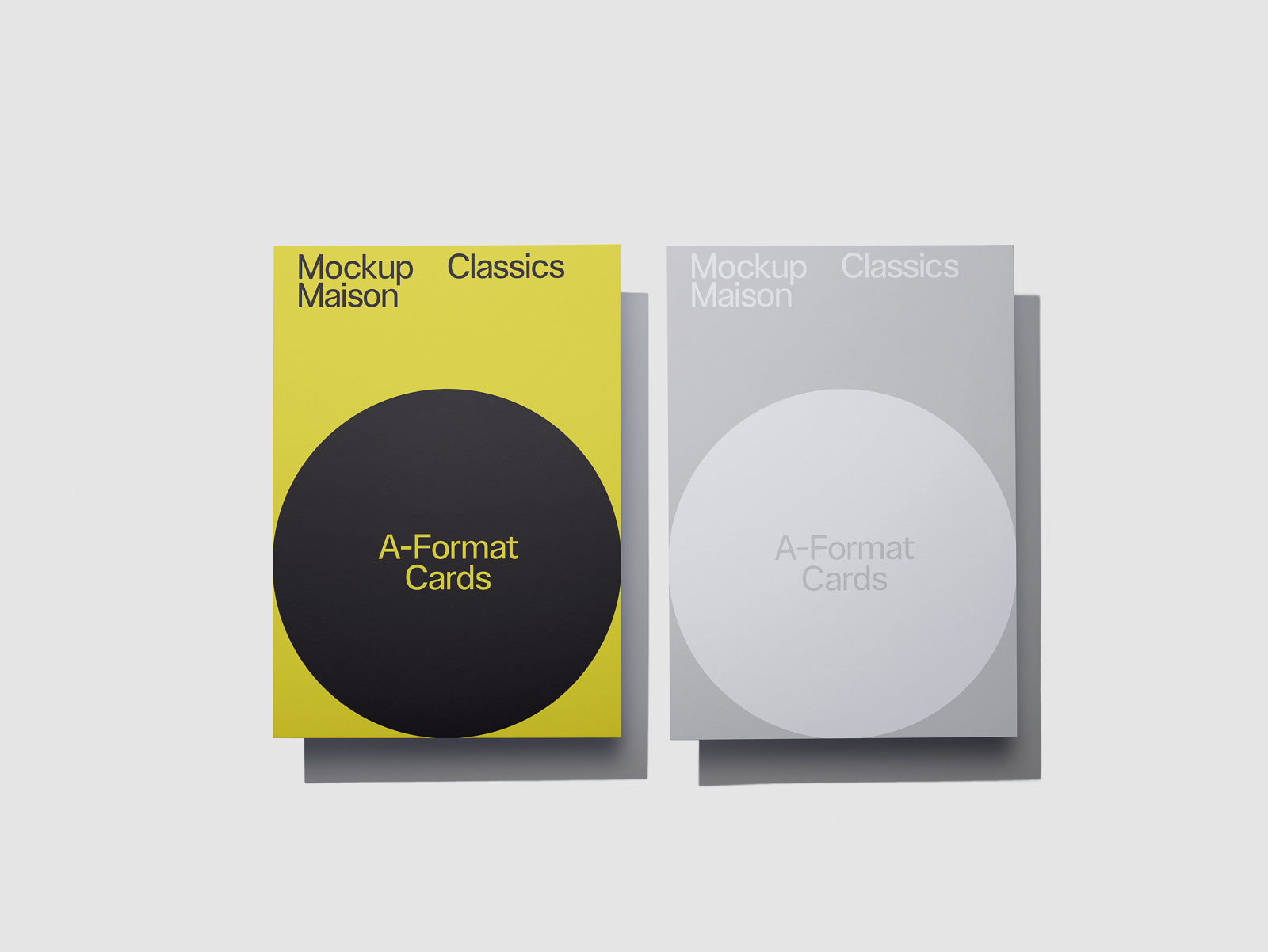 PSD mockup of two A-Format card packages labeled "Mockup Maison Classics" with a yellow cover featuring a black circle and a gray cover with a white circle.