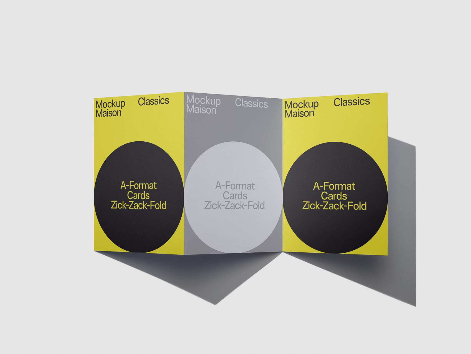 PSD mockup of a three-panel zick-zack-fold card with bold circular designs and a mix of yellow, black, and grey colors, titled "Mockup Maison Classics."